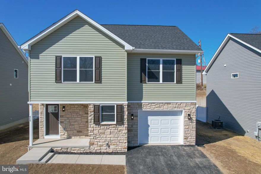 Completed and last available on the street! Why rent when you can buy, home qualifies for first time home buying loan, find out if you do! Make brand new home ownership a reality! Tucked away on the edge of town, with NO HOA you'll find this gem! 3 bed, 2.5 bath new construction home with full basement and attached garage. Home is finished with luxury vinyl plank flooring on main level, stainless steel appliances, upgraded countertops in kitchen and both baths, tile in hall and owner's shower, and upstairs laundry area. The primary suite features a walk in closet, double bowl sinks with granite top, and tiled shower. Public water and sewer, paved road, driveway, and sidewalk.