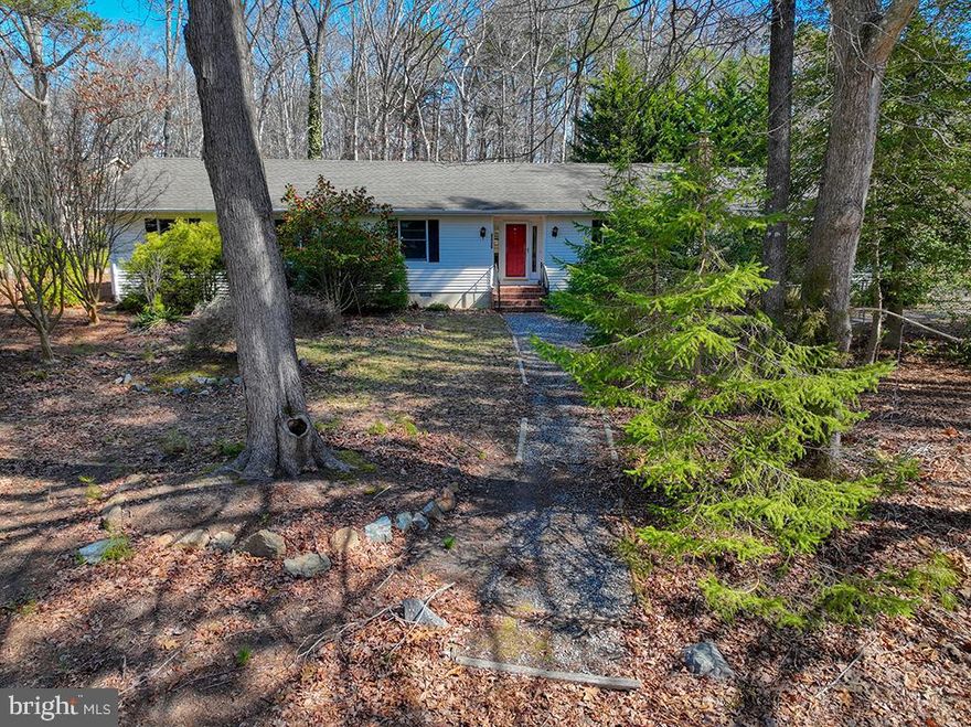 Discover the potential within this spacious 3-bedroom, 2-bathroom ranch-style home, nestled on a serene corner lot in the highly sought-after Woods on Herring Creek community. This property offers a fantastic opportunity to create your dream home in a vibrant neighborhood. Enjoy the expansive sunroom, perfect for relaxing and taking in the picturesque wooded backdrop. This one-level living space provides a comfortable layout, ready for your personal touch. Residents of this desirable community benefit from low HOA fees and a wealth of amenities, including a clubhouse, pool, tennis courts, walking paths, and more. Embrace the chance to customize this home to your unique style and enjoy the wonderful lifestyle offered by Woods on Herring Creek.