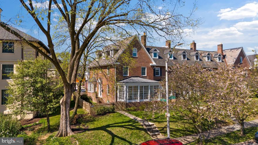 Welcome to 4302 Roland Ave, a timeless Roland Park end-of-group townhome situated on a double-sized lot with a fully fenced yard and a private two-car parking pad.

This bright end unit features 2,316 square feet of finished living space across three levels, offering five bedrooms and two full baths. The home is filled with natural light from southern, eastern, and western exposures. The main level boasts a spacious living room with 9' ceiling, hardwood floors and a wood-burning fireplace, a sunroom perfect for morning coffee, and a huge renovated open kitchen equipped with a professional-grade Blue Star gas range and a breakfast bar island.

The second level features a large primary suite with stylish exposed brick, alongside two additional bedrooms or offices and a renovated hallway bath with a soaking tub. The third level includes two more bedrooms and a modern Euro-style full bath. For your comfort, the home includes central AC, Anderson replacement windows, and gas-powered steam heat.

The property also offers a large basement for storage with direct walk-out access to a stone patio, a lush lawn, and a new Trex deck (2024). Recent updates include the deck (2024), privacy fencing (2024), central AC, and Anderson & Pella replacement windows and doors.

Walking distance to Rotunda, Hampden, Roland Park gems like Petit Louis, Jonny's in addition to playgrounds and parks. Welcome home!