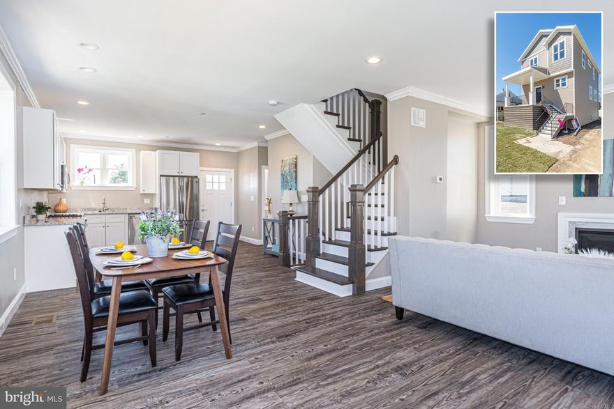 PICTURE PERFECT NEWLY CONSTRUCTED HOME WITH 3 FINISHED LEVELS AND DETACHED 2 CAR GARAGE!  Features include an open floor plan with wood floors & crown molding, spacious living room with a fireplace, gourmet kitchen with granite counters & ss appliances, main level half bath, upper level Primary suite with a walk-in closet and full bath with glass enclosed shower, 2 additional bedrooms with a hall bath, finished lower level with a large family room and 2nd bedroom suite with a full bath, large main level deck, and a 2 car garage with additional driveway parking!  This one has it all!  Buyer to pay all transfer and recordation taxes