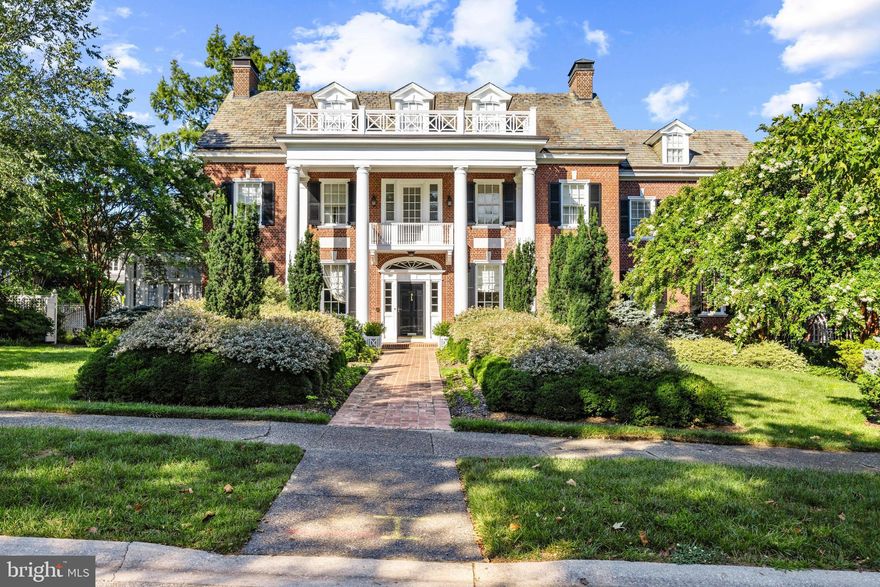 A Timeless Masterpiece in Baltimore’s Prestigious Guilford Neighborhood - Nestled in the heart of Baltimore’s esteemed Guilford neighborhood,  across from the breathtaking Sherwood Gardens, 4102 Greenway presents a rare opportunity to own a distinguished example of early 20th-century architecture. Originally designed in 1916 by renowned Philadelphia architect Louis Harold Rush for his sister and her husband, this stately residence exudes timeless elegance and masterful craftsmanship. In 1925, acclaimed architects Wilson Levering Smith and Howard May expanded and remodeled the home, further elevating its grandeur  Over the past two decades, the current owners have meticulously restored and enhanced the property, cultivating exquisite gardens that transform the landscape into a seasonal spectacle. The front is adorned with vibrant tulips and evergreens, while the rear garden is a sanctuary of blooming roses and lush plantings, offering an enchanting retreat.
An Interior of Unparalleled Elegance - Stepping through the grand entrance, guests are welcomed into a spacious center foyer, setting the tone for the home’s refined interiors. Period lighting fixtures and intricate moldings throughout showcase the unparalleled craftsmanship of the era. Double arched French doors connect the living room to the inviting sunroom, creating a seamless flow of natural light and an airy ambiance. The formal dining room leads into a beautifully appointed butler’s pantry and a chef’s dream kitchen. Custom-built mahogany cabinetry, exquisite Officine Gullo appliances—including two refrigerators, two freezers, an eight-burner gas stove, and double ovens—make this space both functional and luxurious. A large center island provides ample space for culinary creations, while the built-in dining nook offers an intimate gathering spot. A thoughtfully designed rear entryway with built-in closets ensures coats and everyday essentials remain neatly tucked away.

Sophisticated Private Quarters - On the second level, the luxurious primary suite offers a private sanctuary with his-and-hers dressing areas and separate baths. A beautifully adorned guest suite boasts an en-suite bath and an attached sunroom, perfect for relaxation. A charming third bedroom, paneled with hidden cabinetry and closets, is a unique retreat. This level also features a hobby/bonus room and an additional full bath.  The third floor extends the home’s grandeur with two additional bedrooms and two fully renovated bathrooms—one with a shower, the other with a soaking tub. Additional office and den spaces provide the perfect environment for work or leisure.

A Stunning Lower Level for Entertaining - The fully renovated lower level is designed for entertainment and comfort. A second kitchen ensures effortless hosting, while the expansive family room—with a gas-burning fireplace, coffered ceilings, and exposed brick—sets the scene for game nights and movie marathons. Wine connoisseurs will delight in the wine room adjacent to the family space. Additional areas offer flexibility for game tables, exercise equipment, and ample storage.

Exceptional Exterior Features - Practicality meets luxury with a detached two-car garage featuring new automatic doors and a heated driveway, courtyard, and front walkway—eliminating the need for shoveling on snowy days. Above the garage, a renovated studio apartment with a full bath provides a private guest or au pair suite.

A Garden Oasis - The meticulously curated gardens are a true showstopper, bursting with roses and perennials that bloom throughout spring, summer, and fall. Thoughtfully designed hardscaping enhances the outdoor experience, offering tranquil spaces for relaxation and entertaining.

4102 Greenway is a rare gem that seamlessly blends historic elegance with modern luxury, offering an extraordinary living experience in one of Baltimore’s most coveted neighborhoods.