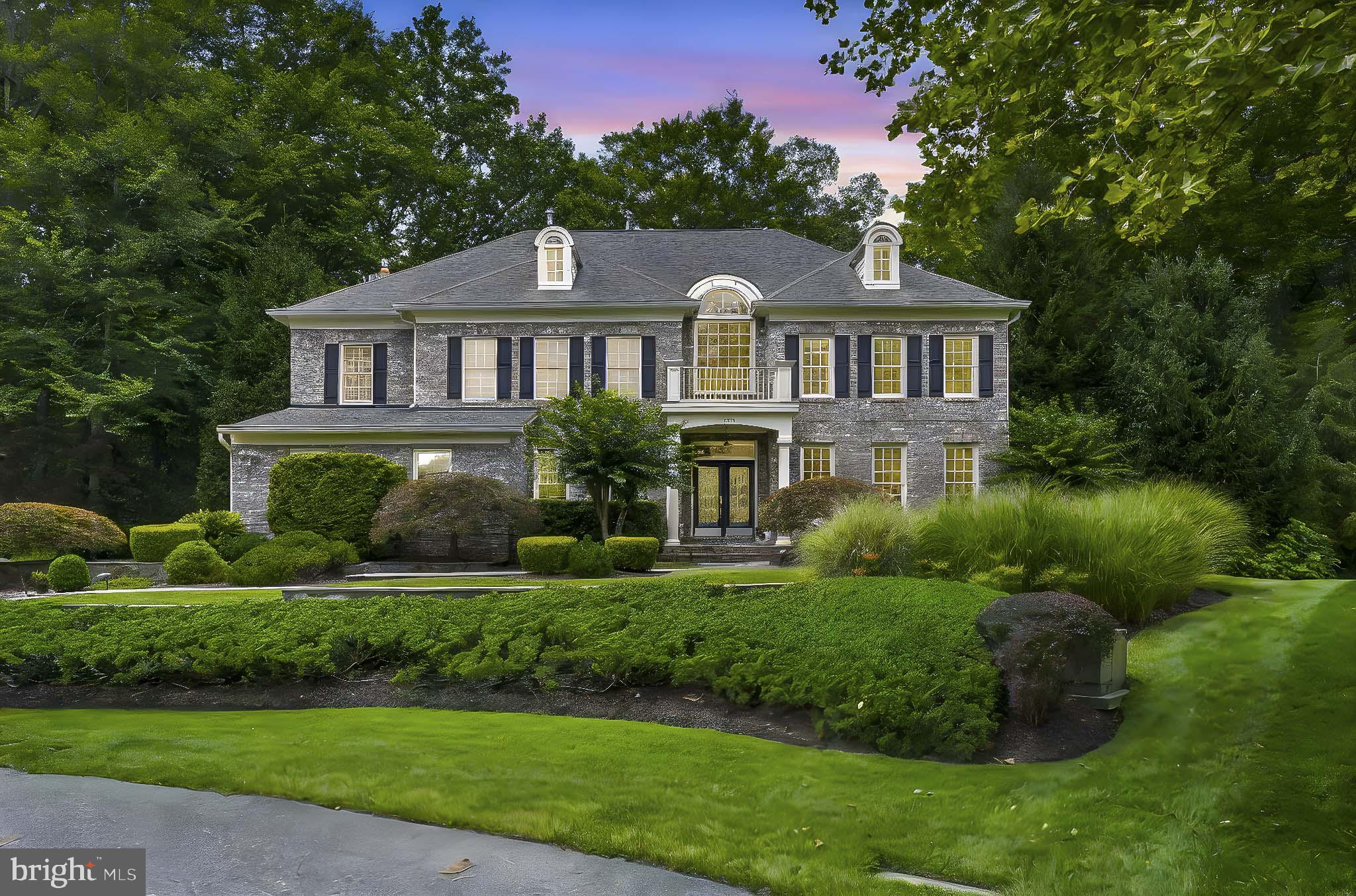 NEW PRICE - a dramatic price adjustment makes this a terrific buy! Located on a quiet cul-de-sac in The Preserve at South River Colony, this elegant and spacious all-brick colonial offers over 6,000 square feet of finished living space on just under an acre with a large side yard, lush landscaping, and private wooded views. Multiple shaded seating areas, a spacious lawn, and plantings designed to delight in all seasons create unique and welcoming spaces for outdoor play, relaxation, and entertaining.
The bucolic surroundings offer a peaceful retreat for nature enthusiasts, with year-round opportunities to observe birds and local wildlife. The professionally designed backyard is supported by a 15-zone, 75-head irrigation system, and features tiered levels, mature plantings, and a canopy of trees that enhance the serene setting. Highlights include an 8,000-gallon stacked-stone pond with waterfall and chemical-free UV light water purification system, and a horseshoe court with regulation pits.
Inside, the front entry showcases marble flooring, soaring ceilings, an Italian alabaster glass chandelier, and a curved staircase leading to the second floor. This 4 bedroom, 5.5 bath home features hand-painted ceilings with a refined faux-marble finish, custom indoor wooden shutters, hardwood floors, two gas fireplaces, classic wainscoting, and detailed millwork. The spacious second floor primary suite features a tray ceiling, two walk-in closets, and a soaking tub with views of the woods. The open kitchen includes dual Bosch dishwashers, a Sub-Zero refrigerator, and an island with cooktop and seating. It adjoins the two-story family room and a sky-lit sunroom that opens out to a gracious, wrap-around back porch, connecting the home to its outdoor setting.
The finished, walk-out lower level has a full bath, large recreation room, wet bar, additional guest room, and abundant storage. The two-car attached garage includes ample built-in shelving and a 32Amp EV charger. The home features a brand new 40-year GAF Timberline HDZ shingle roof with transferable warranty (August 2025) as well as a gas powered generator with transfer station. The home is pet-friendly with a buried electric dog fence.
Sited on a generous lot with public water, sewer, and natural gas, this home is part of the South River Colony Conservancy—an amenity-rich, beautifully maintained community just south of Annapolis. Amenities include a pool with swim league, tennis and pickleball courts, walking trails, and tot lots. The neighborhood is home to The Golf Club at South River, a private members-only 18-hole course with restaurant, fitness center, and golf simulator lounge. The location is convenient to historic Annapolis, the South River, Washington, D.C., and Northern Virginia.