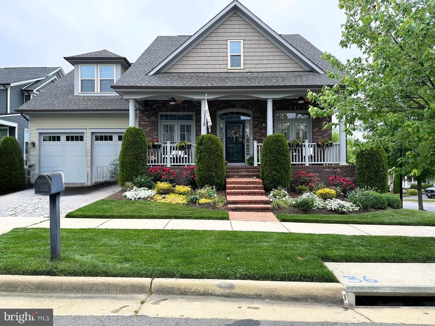 Discover Your Dream Coastal Retreat in Potomac Shores! Welcome to this breathtaking 4,800-square-foot coastal-inspired residence, perfectly nestled on a cul-de-sac corner lot in Prince William County, Virginia's highly sought-after Potomac Shores community. Seamlessly blending elegance with modern comfort, this home is thoughtfully designed for relaxation and entertaining, making it the ultimate sanctuary for anyone seeking a lifestyle of ease and sophistication. Step inside and prepare to be amazed by the light-filled, open-concept design! It will take your breath away. First, you will see a private study with French doors and an elegant formal dining room. The center of the home opens up to a dramatic 20-foot coffered ceiling, 14-foot bookcases flanking a warm gas fireplace, and a show-stopping grand staircase leading to a charming loft with a private bedroom, an en-suite bath, and a walk-in closet creating a perfect guest retreat.  You will immediately be drawn into the light-filled gourmet kitchen with white coastal cabinetry, stainless steel appliances, and a large center island. Adjacent is a large light-filled breakfast room with access to the rear screened covered porch. This breakfast room will not disappoint you if you love a sunrise view. This one makes every morning brighter and more enjoyable.   Head down the hall and see the laundry room, the custom drop center, and two bedrooms. One is a guest suite with an en-suite bath, and the owner's suite is complete with a luxurious spa-like bath with double sinks, a shower, a soaking tub, a water closet, and a fully customized walk-in closet. Next, as you head down the steps, you will be blown away by the impressive 1,900 square-foot daylight walk-out finished basement. Highlights include a custom bar, two under-counter beverage coolers,  and a dishwasher! A large media room, rec room, full bathroom, huge bedroom, and a large storage room. It's an entertainer's paradise!  The home also features three distinct outdoor living spaces! A wide front porch, a rear screened covered porch with stairs leading down to the patio.  You can admire the professionally landscaped backyard with a charming custom shed from here. This fully fenced yard is adorned with hydrangeas, birch trees, crape myrtles, iris, azaleas, and evergreens—a garden lover's dream! The garage is a standout with its slat wall system, ample storage cabinets, and epoxy flooring—providing a place for everything.  Note that the home also has an interior fire suppression system, and the HOA fee is $180 per month, which includes high-speed internet, all Potomac Shores amenities, resident events, and access to the gym, pools, and trails. Living in Potomac Shores gives you access to The Shores Club and Social Barn, an event lawn, community gardens, a multi-purpose sports court, pools, the gym, and all social events put on by the social committee.  The community is home to the only public Jack Nicklaus Signature Golf Course in Northern Virginia.    A future town center and VRE station will soon enhance the convenience of this vibrant community. Don't miss the chance to own this exceptional home that combines coastal charm, modern luxury, and a dynamic community lifestyle. Schedule your private tour today to experience this rare gem for yourself!