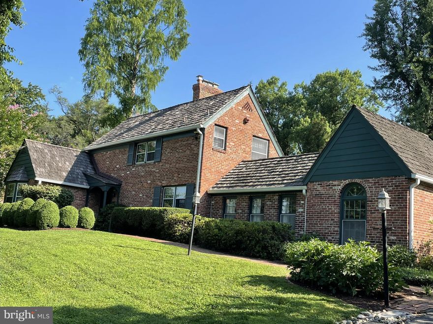 ANOTHER VINTAGE CAPE COD HOME IN THE MUCH-SOUGHT-AFTER WILLIAMSBURG VILLAGE HAS BEEN INTRODUCED TO THE MARKET!  It's solid brick construction and sits stately on over a half-acre lot, The home has been pampered by the current owners. It offers bedrooms and bathrooms on both levels. The kitchen is a true country kitchen with a raised-brick wood-burning fireplace and wide-planked wood floors and a gas oven, as well as gas heat (installed in 2017) There is a Dutch door that opens to the family room, which in turn has double French doors that lead to a large and private patio. Off of the family room there is also a quiet den/study. The living room has exposed hardwood floors, crown molding, wide extended windows, and the 2nd of three fireplaces. The bedroom on this entry level has a bay window and a window seat as well as a full bathroom.  The primary bedroom is located upstairs. It is spacious and has a large bump-out window and window seat, his-and-her walk-in closets and the third wood-burning fireplace and recently refinished hardwood floors. The third bedroom is just down the hall and also has freshly refinished hardwood floors. The basement is a walk-out and offers an inviting recreation room, laundry and utility room as well as a storage room. If you need plenty of parking, the driveway can accommodate seven automobiles. The list goes on. You really have to see this amazing home in person to appreciate all that it has to offer. Hurry, it won't last ! MORE PHOTOS COMING.
