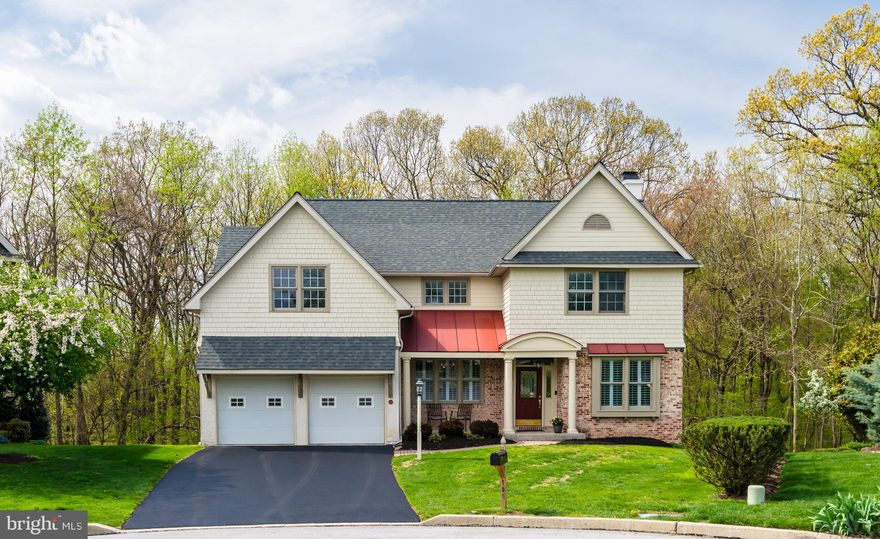 Welcome to 105 Margaret Lane, a beautifully updated and meticulously maintained home offering three finished levels of living space, ideally situated on a quiet cul-de-sac in the award-winning Great Valley School District. A convenient path at the end of the community provides easy walkability to downtown Malvern, local shops and restaurants and the Malvern train station with direct service to Philadelphia. A classic covered front porch leads into the welcoming entrance hall. To the right, a private home office or den is thoughtfully positioned, and to the left is a formal dining room—ideal for both everyday meals and holiday celebrations. The heart of the home is the spacious eat-in kitchen with raised-panel cabinetry, tons of counter space, display cabinetry, and a spacious center island with seating for three.  A generous breakfast area has a doorway to the side deck and offers a seamless transition to the tiled mudroom/laundry room. The kitchen flows easily into the fantastic family room which features a vaulted ceiling, a wall of windows, a gas fireplace, and a doorway to the rear deck overlooking open space. Direct access to the two-car garage via the laundry room and a nicely tucked-away, renovated powder room complete the picture for the main level of this terrific home.  An open, turned staircase overlooking the family room leads to the second-floor landing. The spacious primary suite serves as a true retreat, featuring a large walk-in closet with custom, top-of-the-line adjustable Elfa built-ins and a beautifully renovated ensuite bath. The bath features tile flooring, a quartz-topped double vanity, a standalone soaking tub and an oversized shower with frameless glass doors set against a tile surround wall. A see-through gas fireplace connects the bedroom and bath, a warming architectural detail. A well-proportioned second bedroom and a generously sized third bedroom/home office/den are served by a fully renovated hall bathroom with a double vanity and soft-finished granite countertops. New carpet throughout the second floor gives a fresh, clean feel. The beautifully finished lower level offers exceptional versatility, featuring floating flooring, stacked stone accent walls, full-size windows, and a door providing direct access to the rear patio and backyard. A gorgeous full bathroom includes an oversized shower with handsome subway tile, tile flooring, and a stand-alone vanity. A private dry sauna further enhances this level, which is ideal as a second family room, home office, fitness area, or recreation space. A large storage and utility room completes this level. The outdoor living spaces of this home complement the interior perfectly. A tremendous wraparound deck spans the entire rear of the home and is accessed from both the family room and breakfast area. It provides an ideal setting for relaxing, entertaining on both intimate and larger scales, grilling, and dining outdoors all while overlooking serene open space and wooded surroundings that provide a private, beautiful, ever-changing backdrop throughout the seasons. Gorgeous refinished hardwood floors, plantation shutters, recessed lighting, ceiling fans, new carpet, fresh paint in many of the living spaces and so much more all come together to make 105 Margaret a very, very special place to call home. This is a tremendous property in a prime location. Lovingly maintained and tastefully updated, it offers close proximity to the shops, restaurants, school, and amenities of Malvern, the Malvern Train Station and the Main Line. A rare opportunity to own a terrific home in a highly desirable location in true move-in condition. This is the one you’ve been waiting for—your search is over. Welcome home!