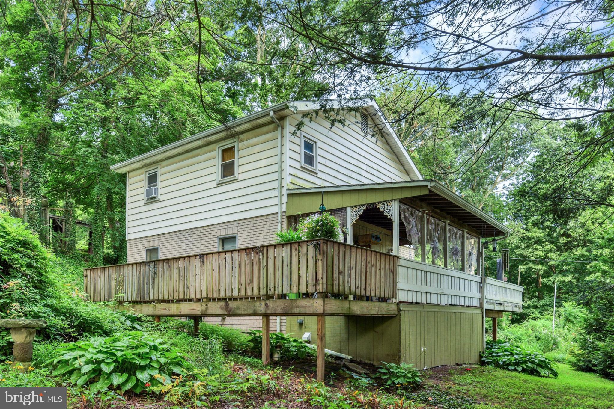 Tucked away in a peaceful woodland setting, this charming two-story home offers a private retreat surrounded by lush greenery, vibrant flowers, and mature shrubs. Whether you dream of planting a garden or simply enjoying the beauty of nature, this property provides the perfect oasis to relax and recharge.
Step inside to an open floor plan designed for both comfortable living and easy entertaining. The spacious primary bedroom features gleaming hardwood floors and offers a tranquil escape at the end of the day.
Enjoy your morning coffee or evening wind-down on one of two expansive private decks, where the sounds of nature set the tone for serene outdoor living. A hot tub adds an extra touch of luxury, perfect for soaking under the stars.
This home includes energy-efficient upgrades such as blown-in attic insulation, wrapped pipes, and additional 2x4 interior studs with added insulation for superior comfort year-round.
The main level offers a welcoming living room, dining area, and kitchen that opens to the deck. Upstairs, you'll find a cozy loft space, two bedrooms, and a full bath. The lower level includes an additional full bath—ideal for guests or flexible use.
If you’re looking for a cozy, well-insulated hideaway with a strong connection to nature, this lovingly cared-for home is ready to welcome you.