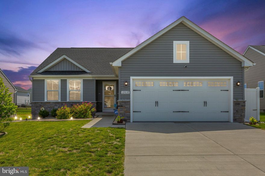 ✨ Stunning 2023 Rambler in Amenity-Filled Community –

This beautifully crafted single-story rambler, built in 2023, is ready for you today. Designed with modern finishes, open spaces, and the perfect balance of comfort and style, it’s a rare opportunity you don’t want to miss.

From the striking stone façade and carriage-style garage to the private stone patio with evening lighting, every detail makes a lasting first impression.

Inside, the inviting foyer flows seamlessly into the fully finished basement and garage access. Just beyond, two spacious bedrooms and a beautifully tiled full bath offer ideal guest or family space.

The heart of the home is the expansive great room, where a cozy living area, bright dining space, and gourmet kitchen come together. The kitchen is a showstopper—gleaming quartz countertops, white cabinetry, stainless steel appliances, and a walk-in pantry make it both functional and beautiful.

At the back of the home, the luxurious primary suite feels like your own retreat—complete with a spa-style bathroom featuring a wide tiled shower with bench seating, dual vanities, and a generous walk-in closet.

The fully finished basement offers even more living space with stylish LVP flooring throughout. Enjoy a spacious rec room, an additional large bedroom, another full tiled bath, a versatile flex area, and abundant storage.

This amenity-rich neighborhood has it all: a clubhouse, pool, fitness center, tennis courts, walking trails, playgrounds, and even a boat ramp for easy access to the Rappahannock River. Plus, you’ll enjoy a convenient commute to Fredericksburg, Southern Maryland, Richmond, and Quantico.

Don’t wait—schedule your private showing today and see why this 2023 rambler is better than new construction!