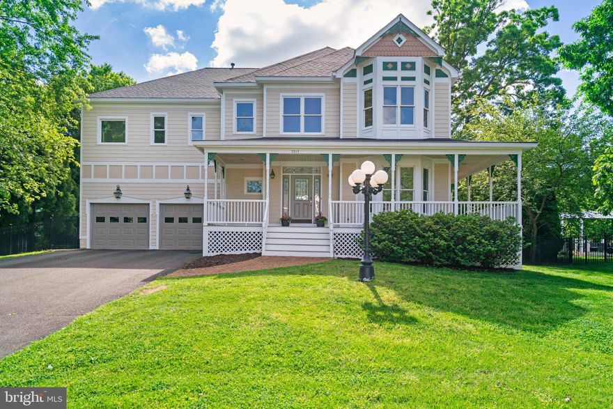 OFFER DEADLINE has been set for Tuesday, May 20th at noon.  Welcome to this stunning Modern Victorian with an open-floor plan, ideally situated on a quiet street with a cul-de-sac.  With its charming wraparound front porch and classic hardiplank siding, this 5 bedroom home boasts undeniable curb appeal, not to mention a wonderful half acre lot that backs to trees.  Inside, over 5,000 square feet of thoughtfully designed light-filled living space awaits, featuring soaring 9-foot ceilings, three fireplaces, including a dramatic two-story stone fireplace framed by windows anchoring the light-filled great room. The grand two-story foyer welcomes you with a coat closet and powder room and flows seamlessly into an elegant living room with a gas fireplace and formal dining area—perfect for entertaining! The back of the home with a second staircase going upstairs is the ideal space for hanging out.  The refreshed kitchen impresses with refinished white cabinetry, new wide plank luxury vinyl plank flooring and a gas stovetop, opens directly to the great room and offers easy access to the expansive back deck.  The deck spans the width of the house overlooking a large beautifully fenced, flat yard with a cement recreational pad - perfect for basketball, a raised garden and shed. A private main-level office with built-ins, a functional mudroom with a dog washing station, and an oversized two-car garage with loft storage embellish life's everyday conveniences.

The upper-level features hardwood floors, a versatile loft bonus space overlooking the great room—ideal for reading, studying, or relaxing with friends. and a spacious primary suite with a large walk-in closet and a spa-like bath with a whirlpool tub, his/her vanities, and a walk-in shower. Three additional generously sized bedrooms, two full baths, and a convenient laundry room with a large linen closet complete this level.  The fully finished lower level offers over 1,000 additional square feet of newly carpeted living space. It includes a fifth bedroom, full bath, expansive recreational space featuring a pool table, a wet bar with mini fridge, a cozy family space with fireplace, extensive storage and a dedicated workshop. Recent 2025 updates include fresh paint throughout, new carpet in the lower level, refinished main-level hardwoods, and exterior upgrades such as power-washing and refinishing of the front porch and rear deck. With a new roof (2023), newer HVAC (2020), and Kenmore Elite washer/dryer (2019), this home is truly move-in ready. Just minutes from amazing restaurants and shops in Falls Church City, the Mosaic District, and Tysons Corner, and conveniently located near two Metro stations (West Falls Church Metro and Dunn Loring Metro) and major commuter routes (66, 495 and Rte.7), Trader Joe's, a bike path and two parks, this is luxury living in an unbeatable location.