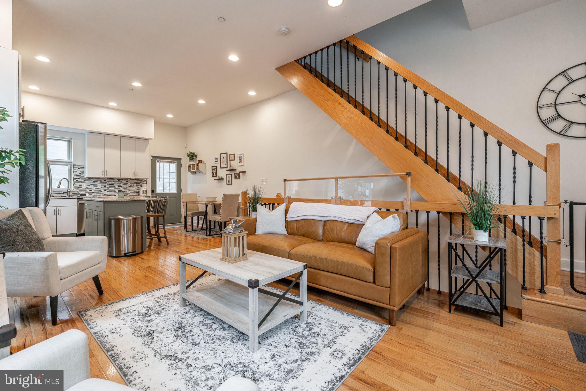 Welcome Home to 2307 Carpenter Street, a stunning 3 bedroom, 2.5 bathroom Graduate Hospital corner townhome with private roof deck! Upon entering, you will immediately notice the ample natural light flowing thru the the large corner windows, soaring ceilings, and beautiful open tread stairs. The open-floor concept creates a bright and inviting ambiance. Towards the rear, you will find the updated chefs kitchen featuring stainless steel appliances, 5-burner electric stove, marble countertops, large center island with barstool seating and access to the private outdoor patio. On the second floor, you will find two spacious bedrooms, both with recessed lighting, ample closet space, and large windows. A spacious full bathroom with shower tub and room for storage is located between the two bedrooms. On the third floor, you will find the primary ensuite. The spacious primary features tons of natural light, a private balcony, walk-in closet and full bathroom with jacuzzi tub and vanity storage. Finally, the spacious roof deck features 360 degree views of the skyline to the North and South Philly stretching down to the stadiums. The stairs off the kitchen area lead to a fully finished basement with high ceilings, powder room, closet for storage, and laundry room with washer/dryer, and room for storage. 2307 Carpenter is a must-see. Located in the charming Graduate Hospital neighborhood, surrounded by high-end new construction. This home is walking distance CHOP, Penn, South St, grocery stores like Giant's Heirloom Market and Sprouts, the Schuylkill River Park, and bars/restaurants like Loco Pez, Dock Street Brewery, The Sidecar, and much more! Schedule your showing today!