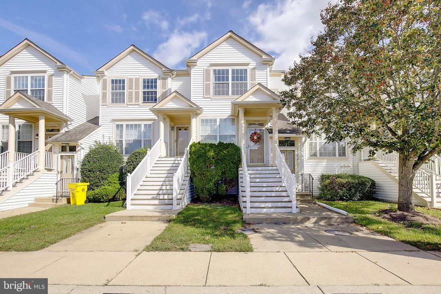 Welcome to Cedar Grove at Crofton! This home is absolutely move-in ready and has all the right updates that make it feel fresh and stylish. Even better, it’s tucked into a premium spot in the neighborhood—on the last street, so it backs to trees for extra privacy and quiet, while also giving you the advantage of nearby extra parking.

Enjoy easy, low-maintenance living — all exterior upkeep is handled for you! The condo association maintains the roof, siding, steps, and landscaping, so you can spend less time worrying about chores and more time enjoying life.

Step inside and you’ll love the new luxury vinyl plank flooring on the main level, with soft blends of grey and beige that flow beautifully with the neutral grey paint. Upstairs, plush carpet runs through the entire bedroom level, keeping things cozy and comfortable.

The kitchen is a standout—stainless steel appliances, granite counters, and plenty of cabinet space to keep everything neat and organized. The living room has a wood-burning fireplace with a grey and white marble surround, making it the perfect spot to gather or show off your favorite décor. Just off the living room, a 10x8 composite deck gives you a peaceful view of the tall tree line that makes Cedar Grove so serene.

The Bancroft model bedrooms are generously sized with great closets, and each has its own full bath for convenience and privacy. The whole home feels clean, stylish, and cared for—ready for its next chapter.

You’ll also love the community amenities, including a neighborhood pool, and well-kept parking areas that are taken care of by the condo as well.

Beyond your front door, you’ll love being in the heart of Crofton. Restaurants, shops, gyms, golf courses, parks, movie theaters—you name it, it’s close by. The schools are a bonus, and whether you’re working from home or commuting, you’ve got easy access to Route 3, 97, 32, 100, and 50.

This home checks all the boxes: move-in ready, in one of the best locations in the neighborhood, and filled with charm. Don’t miss your chance to make it yours!