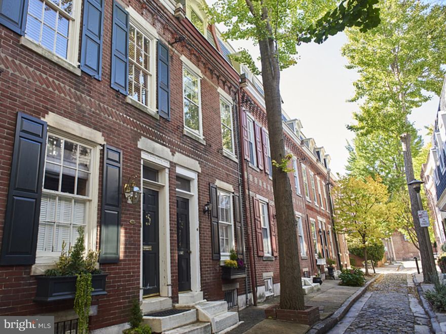 Situated on a quiet, quaint, tree lined cobblestone alley, where Washington Square West meets Society Hill, this charming, historic 1-2 bedroom classic Philadelphia Trinity is perfect for the first time buyer. This home is filled with character featuring large windows, original refinished hardwood floors, exposed brick, high ceilings and wonderful garden with custom brick planters. Enter the first floor kitchen and private garden area, second floor is currently used as living room and adjacent bathroom, and third floor bedroom with closet. Basement houses washer/dryer, storage and mechanicals. Super convenient location within just a few blocks of Pennsylvania and Jefferson Hospitals, WholeFoods, Acme, CVS, Washington Square Park and the countless restaurants, shops and services on and around South St. Don't miss your chance to live on one of the most picturesque streets in Philadelphia.