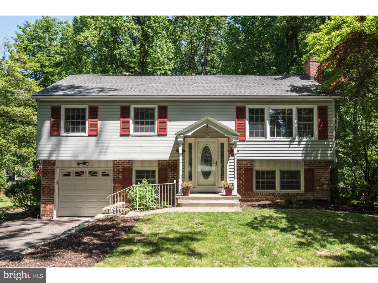 Sitting quietly on a corner lot with mature trees, and walking distance to the neighborhood park, this three bedroom, two bath home in the Downingtown School District has been beautifully updated by the current owner.  If not for a work transfer, they would not be moving.  The main floor features hardwood floors throughout with crown moldings and large windows.  The living room has built in shelves and cabinets and opens up to the dining room and kitchen making this space perfect for entertaining.  The dining room features a sliding door out to the multilevel deck and spacious back yard.  The kitchen was completely renovated in 2014 and includes high end cabinetry, stainless appliances, ceramic floor, custom back splash and designer lighting.  All three bedrooms are together on the main floor with each looking like a page from a decorator magazine.  The lower level features a stone, wood burning fireplace and a matching stone wet bar.  The family room has brand new carpet and is adjacent to the second full bath.  There is also access to the backyard with large windows looking to both front and back making this space feel more open, as well as access to the large mudroom with laundry facilities, which were updated in 2014, and the one car garage.   The home has additional storage throughout and pull down access to the attic.