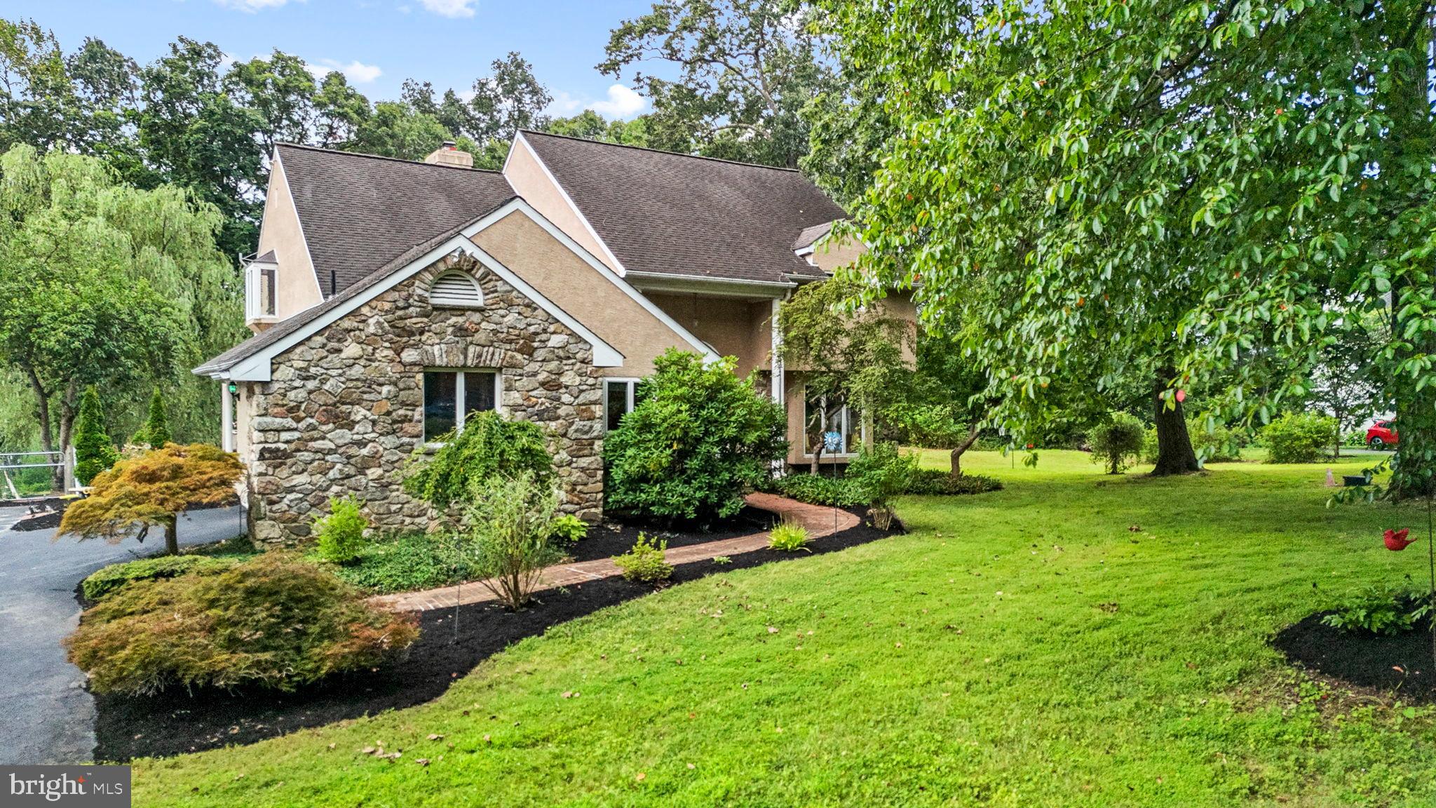 Welcome to this spacious 3-bedroom, 4.5-bathroom home nestled on a picturesque 3.2-acre lot in East Fallowfield Township. Offering a peaceful country setting with plenty of room to spread out, this home blends comfort, functionality, and opportunity for outdoor enjoyment. Inside, you'll find a thoughtful layout that includes a full, finished basement, a dedicated first-floor home office, and an additional living area with a kitchenette and full bathroom; ideal for a guest suite or a potential first-floor bedroom conversion. Continue into the bright, eat-in kitchen that flows seamlessly into the family room, complete with a cozy gas fireplace and soaring vaulted ceilings; a perfect space for everyday living and entertaining. Upstairs features three large bedrooms, including a primary suite with an updated bathroom, a jacuzzi tub and spacious closet. Step outside to your own private backyard retreat! The expansive oversized deck is perfect for summer cookouts and entertaining. Take a dip in the above-ground pool which is salt water and heated, or relax in the large, enclosed sunroom, ideal for three-season enjoyment with panoramic views of your tranquil property. The backyard also offers plenty of open space for a garden, play area, fire pit, or even a future outbuilding. Whether you're hosting gatherings, enjoying quiet evenings under the stars, or simply taking in nature, this outdoor space is ready for your vision. For peace of mind, the stucco exterior was recently repaired and updated, ensuring lasting curb appeal and protection for years to come. Don't miss this rare opportunity to own a versatile home on a beautiful, wooded lot; just minutes from major routes, yet tucked away for privacy and peace. Schedule your private showing today!