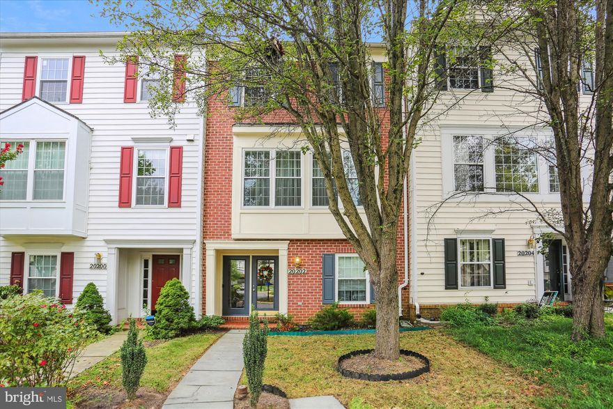 Welcome to 20202 Yankee Harbor Pl! This elegant and spacious 4-bedroom, 2.5-bathroom townhouse offers comfort, style, and convenience in a desirable location.  Spacious foyer entrance leads to a bonus room that offers walk out access to the back yard. The ground level includes one bedroom or office space. Main level features a large living and family room with hardwood floors that seamlessly leads to the dining room. Recently renovated eat-in kitchen with an island and easy access to outdoor deck. The upper levels offer three large bedrooms and two full bathrooms. The primary bedroom has an abundance of natural light with over 9ft ceilings, a walk-in closet, and an updated attached full bathroom. Enjoy outdoor living on your private balcony. Don't miss out on the opportunity to make this beautiful townhome your new home sweet home.