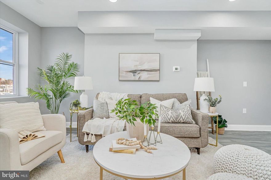 Welcome Home to 453 W 24th Street!!  This Beautifully updated Townhome offers the space you need to create a life you desire.  Boasting an array of sleek finishes throughout this 3 Bedroom, 2.5 Bathroom home has so much to offer!!  The main level offers an open concept layout featuring a spacious living room, dining area, kitchen and half bathroom.  Kitchen boasts S/S appliances, white shaker cabinets, Granite counters and MORE!  Upstairs you'll find 3 spacious bedrooms and 2 full bathrooms.  This includes the primary bedroom with en-suite bathroom.  All bathrooms have new ceramic tile and fixtures.  Basement has been finished to include a spacious Rec Room perfect for entertaining!!  All new flooring throughout, freshly painted and SO MUCH MORE!!  Book your private showing today before it's gone!!