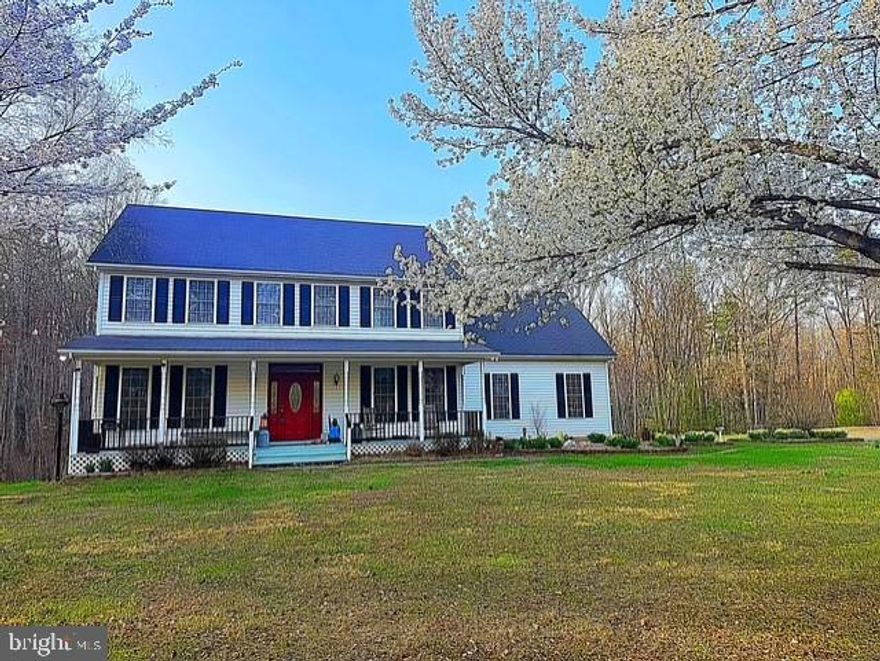 Stunning custom-built 5BR/4BA Colonial on 11+ private acres offering three finished levels, exceptional flexibility, and endless space to live, work, entertain, and unwind. Lovingly maintained by the original owner, this impressive home blends timeless charm with thoughtful updates and incredible functionality—including a private bonus suite over the garage, ideal for guests, multi-generational living, or a private retreat.

Step inside to a spacious and inviting main level featuring beautiful hardwood floors, a private home office/den, and an oversized living room anchored by a cozy gas fireplace. The expansive country kitchen is truly the heart of the home, designed for gathering and entertaining with abundant cabinetry, oversized island, pantry, coffee bar, wine fridge, generous prep space, and a bright breakfast area. A formal dining room is ready for holiday dinners and special occasions, while a full bath and main-level laundry add everyday convenience.

Upstairs, the spacious primary suite offers a relaxing retreat with a large walk-in closet and private bath featuring double vanities, walk-in shower, and an oversized soaking tub. Three additional generously sized bedrooms and updated luxury vinyl plank flooring complete the upper level.

The fully finished walk-out basement offers incredible versatility with a large family room, kitchenette with microwave and mini fridge, full bath, additional laundry hookup, and flexible-use space perfect for a gym, playroom, media room, or hobbies. Unfinished workshop and storage areas provide room for projects and future expansion.

Outdoor living is just as impressive with a welcoming front porch, covered rear porch, and massive multi-tiered deck designed for entertaining and relaxing year-round. Enjoy evenings around the fire pit, covered seating areas, expansive parking, and peaceful country views in every direction.

This property is a dream for hobbyists, contractors, RV owners, or anyone needing exceptional workspace and storage. Features include an oversized attached two-car garage, detached one-bay garage/shop with power, woodworking shop, 30-amp service, spacious 24x36 loft area, and a large RV shelter garage.
Surrounded by wooded privacy with a large open yard, this beautiful 11+ acre property offers the perfect balance of peaceful country living and everyday convenience just minutes from schools, shopping, dining, and historic downtown Culpeper

 Recent updates include fresh interior paint (2026), dual-zone HVAC (2022), water softener (2025), well pump and sump pump (2024), water heater (2020), updated upper-level LVP flooring, and freshly painted decking.