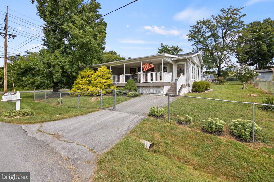 Welcome to 1300 Raleigh Street, a beautiful rancher in the heart of Martinsburg. From the moment you arrive, you’ll be charmed by the fenced yard, lush landscaping, and mature trees. The driveway leads to a spacious detached garage, ideal for vehicle storage or a workshop, with an additional well-appointed storage shed just behind it. Entering from the back, you’ll step onto an impressive tiered deck that flows into a gorgeous sunroom. Surrounded by large windows, this inviting space offers the perfect spot to relax and take in the view of the yard. From the sunroom, you can access a covered front porch, an ideal hangout for morning coffee or evening conversation. Inside, the open and welcoming living room features a beautiful electric fireplace and stylish LVP flooring. The adjacent kitchen is finished with light-toned cabinetry that creates a bright, airy feel. The first of two full bathrooms is located off the hallway, complete with a large sink, stand-up shower, and convenient laundry closet. Across the hall sits the first bedroom, featuring LVP flooring, a ceiling fan, and plenty of natural light. At the back of the home, the primary suite offers a spacious walk-in closet and a private en suite bath. Blending modern updates with thoughtful design choices, this home delivers comfort, style, and convenience in one perfect package. Schedule your showing today!