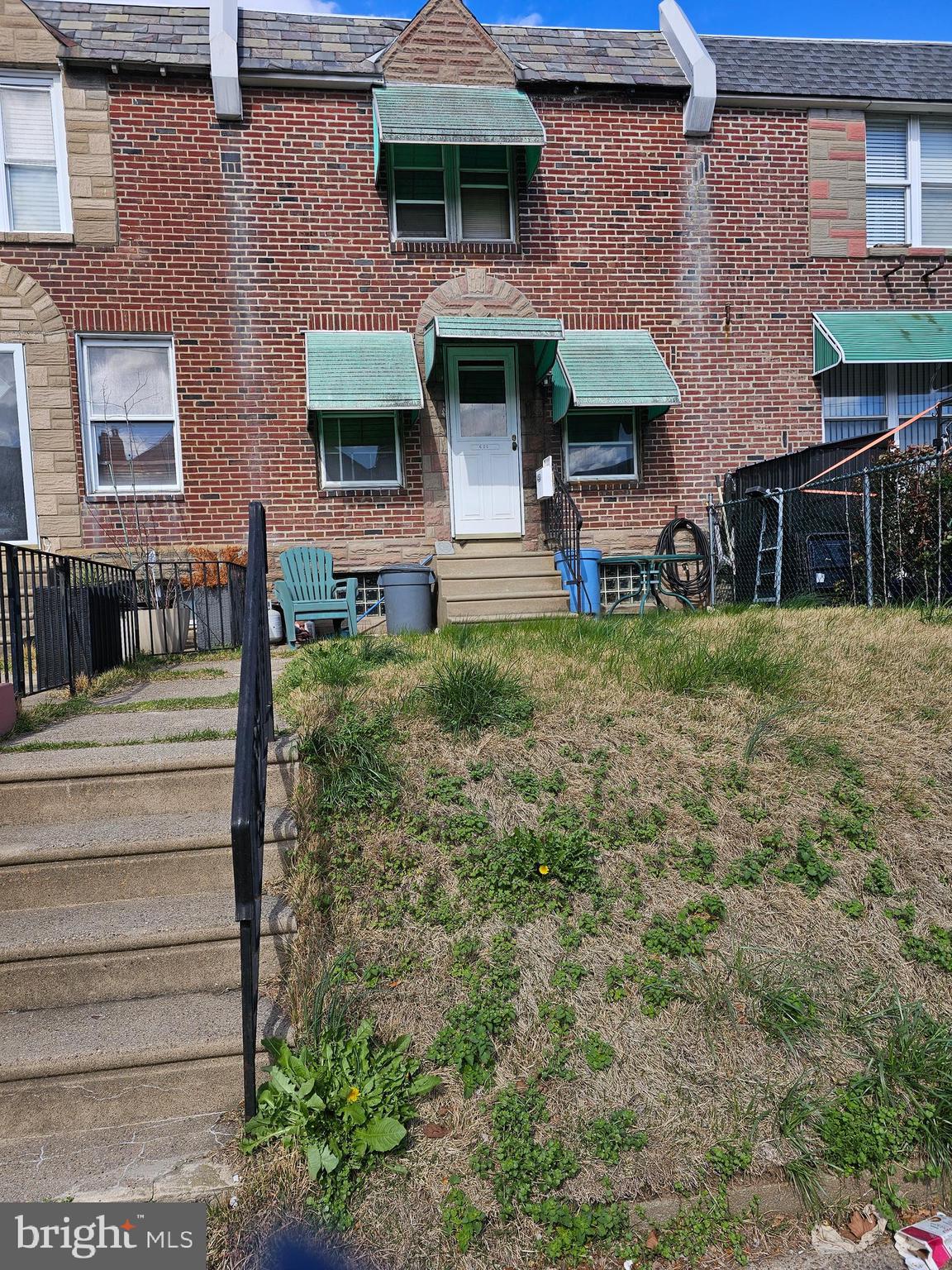 3 bedroom, 1 bath row home with front patio area and rear garage. Property needs work and is being sold "As IS" seller will not make any repairs, but is willing to clean out contents.