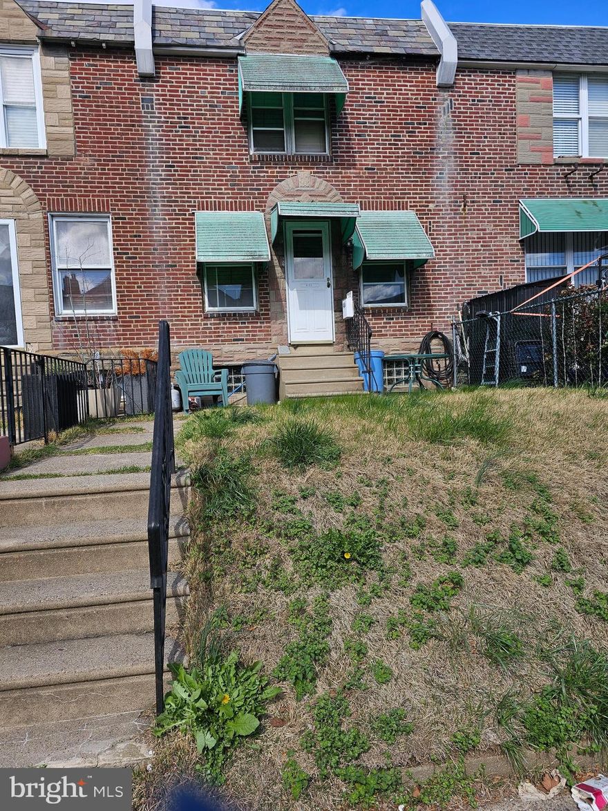3 bedroom, 1 bath row home with front patio area and rear garage.  Property needs work and is being sold "As IS" seller will not make any repairs, but is willing to clean out contents.