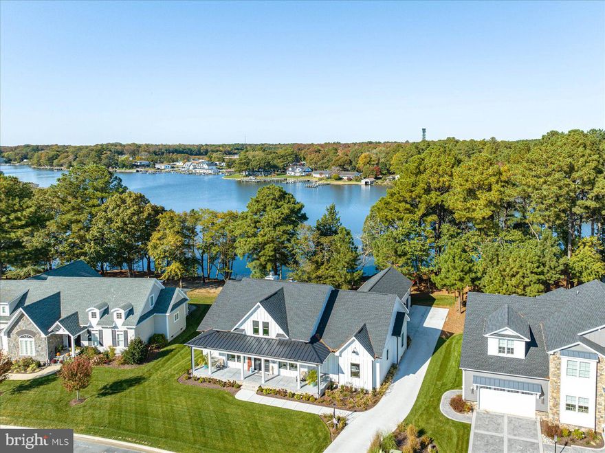 Rarely available waterfront home in Glen Riddle featuring 102' of frontage on Turville Creek.  This custom-built home was just completed in the Spring of 2023 and features 5 bedrooms and 4 full bathrooms.  With nearly 3,500 interior square feet spanning over two levels this home has everything you are looking for in a second home or primary residence.  You are first greeted with a southern exposure concrete porch spanning the length of home.  Upon entering the double glass front door, you will immediately be taken back by the water views of Turville Creek through the living room sliding glass door.  Next you will notice the fine craftmanship of the Amish crafted barn doors surrounding the large office space that is flooded with natural light all day long.  Moving further into the home the open concept living flows beautifully from the foyer to the great room featuring the living room, dining room, and chef's kitchen.  The living room has a large wood burning fireplace accented by Amish built bookcases on either side.  The kitchen has a massive quartz island that comfortably seats four.  White shaker style cabinets with black handles, a quartz backsplash, and commercial grade stainless steel appliances are just what the chef in your family is looking for!  If storage tops your list you will adore the oversized hidden pantry with shelving galore.  A 12' slider in the living room leads to one of the coolest outdoor spaces on the shore, an oversized raised and covered concrete patio with its very own full sized wood burning fireplace prewired and waiting for your big screen TV.  Watching your favorite program with never be the same after you watch it outdoors waterfront by a roaring fire.  The patio also features a beverage center area to keep all of your refreshments nearby.   Follow the steppingstones down to sit waterfront on your small private beach and take in the scenery including an abundance of wildlife.  When it's time for bed choose one of the 5 spacious bedrooms serviced by 4 bathrooms.  The most exciting being the first-floor primary bedroom with views of Turville Creek and an attached spa like bathroom.  The centerpiece of the primary bathroom is a gigantic quartz shower with rainfall showerhead.  Separate Amish crafted vanities allow for plenty of storage and are also covered in stunning quartz tops.  The walk-in closet feels more like a second bedroom and includes custom closet organizers with a place for everything.  Guests will feel right at home in one of 3 other 1st floor bedrooms.  Each guest bathroom also has Amish crafted vanities with quartz countertops and grout less quartz showers.  The last features of the first floor include a large laundry room with extra cabinets for storage and mud room leading to the 3-car side load garage.  Take the rear staircase to the second floor to find another oversized living room currently setup with another office, game area, and TV area, but you can use the space as you wish.  A full bathroom is also located on this floor.  Slide open another Amish crafted barn door on this level to access the 5th bedroom that also has peaks of Turville Creek.  Additional features of this custom-built residence include a conditioned crawlspace with concrete flooring accessed from inside allowing for additional storage and a tankless on demand gas hot water heater.  Not to mention, this stunning waterfront residence is located in the manicured community of Glen Riddle where your low monthly HOA fee of $275 includes professional lawncare, the annual mulching of front garden beds, community snow removal, and access to the clubhouse featuring two game rooms, a full gym, outdoor pool with built in spa, locker rooms with saunas, and a large meeting room.  Across the street from the clubhouse are tennis courts.  If you have a boat, a 99-slip marina could be your solution.  The slips are all individually owned but can be purchased when available.  Schedule you're showing today!