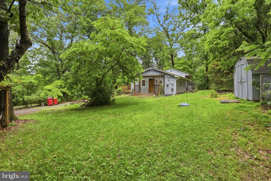 Tucked away in a private setting near historic Harpers Ferry, this charming cabin-style retreat offers the perfect blend of rustic character and peaceful seclusion. Inside, you’ll find an inviting open floor plan with cathedral ceilings that create a warm and spacious atmosphere. The home features a cozy kitchen, two bedrooms, and a full bathroom designed for easy living and relaxation.

Outside, the property includes three storage sheds, providing ample space for outdoor gear, hobbies, or workshop needs. Whether you’re looking for a full-time residence, a serene weekend escape, or an income-producing Airbnb opportunity, this unique property offers endless potential.

Located just minutes from historic Harpers Ferry, you’ll enjoy easy access to quaint shops, local dining, hiking trails, river activities, and rich Civil War history. The property is also in close proximity to Harpers Ferry Brewing, the Adventure Center, and River Riders, offering year-round recreation including whitewater rafting, tubing, ziplining, kayaking, fishing, and winter snow tubing. Spend your days exploring the scenic beauty where the Potomac and Shenandoah Rivers meet, then return home to your own private mountain getaway. This is the ideal destination for anyone seeking relaxation, adventure, and the charm of small-town West Virginia living.
