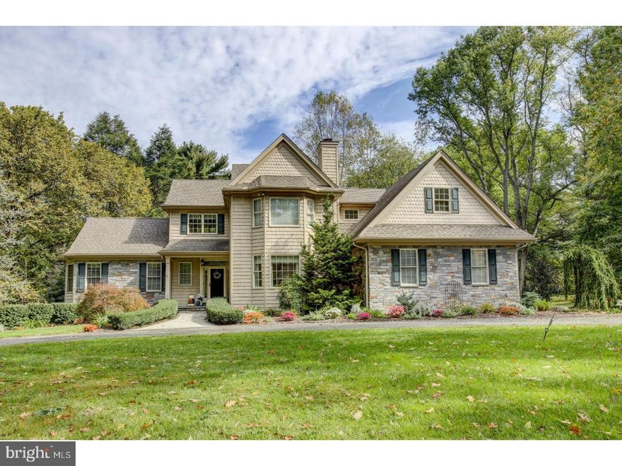 Set on an idyllic lot on one of Rose Valley's most desirable streets, 16 Hilltop is a custom home being sold by a very well respected local builder Jack Quindlen,  who has enjoyed living in this magical location for many years.  This home captures the charm of classic aesthetics and perfectly marries them to the luxury and ease of modern convenience.  A circular driveway makes for easy access to the front porch made of PA Bluestone, and the front door with leaded glass side panels and transom welcome you into this gracious home which is brimming with upgrades.  Rich finishes and design details such as transom windows, sparkling hardwood oak floors, crown molding, deep baseboards, Pella bay windows are found throughout giving you a feeling of grace and elegance.  The fabulous Kitchen is handsomely outfitted with Dacor 6 burner stove, wall oven and microwave, Bosch dishwasher, and gorgeous granite countertops is an ideal place for casual gatherings.  With a large center preparation island, double tray ceiling above the Breakfast Room, second preparation sink, desk area and sideboard, you can easily envision entertaining friends and family.  What makes this space so special are the charming touches so effortlessly integrated such as a plate rack, built up Dining Bar with pendant lighting and access to a fabulous screened Porch with a wood burning fireplace?ideal for enjoying the natural surroundings that make Rose Valley so special.  A first floor Master Bedroom Suite has a lavish Master Bath with a jetted tub and serpentine shower warmed by radiant heat in the floor.  There are 4 additional bedrooms, all with their own private full baths along with a full bath in the Lower Level.  When you enter the Lower Level through wide French doors you find an extraordinary entertainment space warmed by a gas fireplace in the gathering area, and a gaming area all finished with attractive crown topped wainscoting.  With large French Doors leading outside, the possibilities for enjoyment are unending!  There is also a gym/yoga studio space and a connection to the 2nd staircase from here.  Because of the unique layout of the home there is ideal space for an au pair/inlaw suite or a private office separate from the other rooms on the second floor and also accessible by the 2nd staircase.  With a 3 car attached Garage on a picturesque lot that is almost an acre this home has the flexibility to suit your needs?and do so with style! Call today to see this distinctive home!