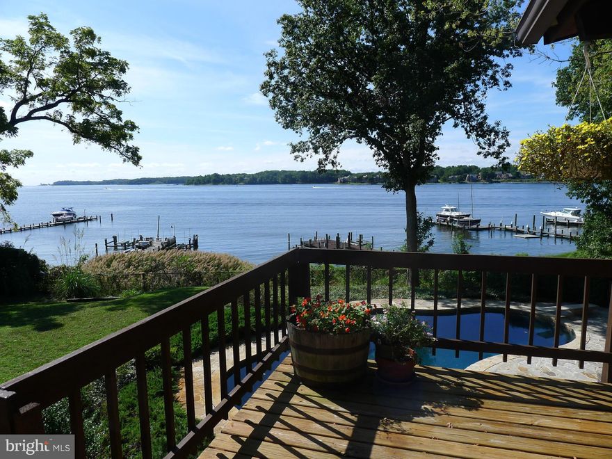 Post & beam Deck House with cedar cathedral ceilings & abundant windows with sweeping views of the South River / Waterside Pebble Tech swimming pool / Gently declining steps to waterfront with sandy beach at low tide / Private pier with 3 lifts / Extended private driveway / Spacious Owners Suite with His & Hers baths, 3 closets & dressing room /Office / Owner financing considered /