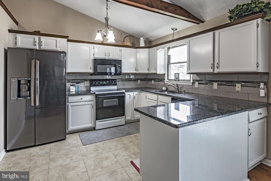 Back on market due to no fault of seller.  Buyer lost the buyer of their home 3 days before closing!   Affordable country living can be yours! Great opportunity to own this very spacious 2078 sf bi-level with 2.5 car garage on a beautiful fenced .64 acre level lot!  The garage is a dream for those who love their toys or desire a workshop.  It is surprisingly huge and has an epoxy floor.  Upper level features great room with a brick fireplace, bay window, and a vaulted ceiling that connects to the kitchen.  Kitchen was updated in 2018 and is loaded with cabinetry and natural light. French door to the back deck overlooks the massive backyard, patio, firepit and pool. A large family room is located on the lower level and features a stacked stone section that originally housed a woodstove.  All Three of the full bathrooms were remodeled in 2018 and are large.  The main floor primary suite connects to the 4th bedroom through the closet.  The previous owner used that bedroom as a closet, but it easily could become the 4th bedroom by closing off the closet entrance.  Located on a single cul-de-sac street, this is an ideal location for years of quiet enjoyment!