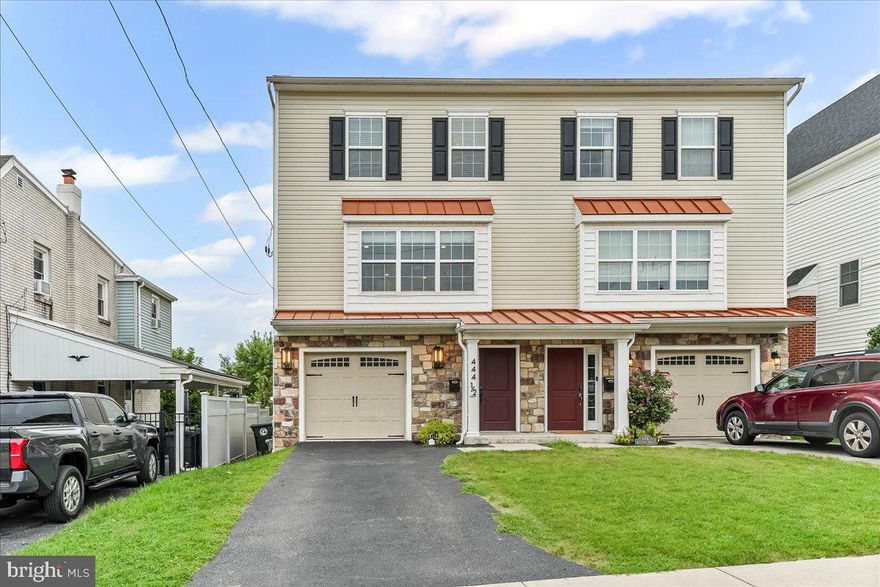 Welcome to your dream rental home nestled in the heart of Conshohocken Borough! This beautifully maintained twin home offers modern amenities and thoughtful upgrades, ensuring comfort and convenience for its new tenants. As you step inside, a welcoming foyer guides you to the garden-level den/office with plush carpeting and direct access to the spectacular flagstone patio and fully fenced backyard! This level also includes a powder room and direct access to the attached garage. Upstairs find the spacious and inviting family room graced with high vaulted ceilings and expansive windows equipped with electric shades, controllable via remote or app. The family room, with its cozy gas fireplace,  storage closet and second powder room leads directly to the upper deck with spectacular views and new staircase to the beautiful yard below. The adjacent gourmet kitchen is a chef's paradise, featuring 42" cabinets, granite countertops, a breakfast bar, and stainless steel appliances, seamlessly flowing into the dining area for entertaining. Enjoy delightful meals with a stunning view of the nearby park. This home includes two full bathrooms and two powder rooms with stylish new fixtures. The upper floor,  owner's suite is a true haven with cathedral ceilings, two walk-in closets, and an ensuite bathroom that features a double vanity and walk-in shower. Two additional bedrooms provide ample space and share a full hallway bathroom. The upper level is completed with a laundry room and all new carpeting. For year-round comfort, the home boasts dual-zone HVAC with Ecobee Smart thermostats. The fully fenced backyard, accessible from the deck off the great room via a new staircase, is perfect for outdoor gatherings. The home has been freshly painted; security features include a storage cabinet, Ring camera doorbell, and backyard camera. The garage offers overhead storage racks, and the front door is equipped with a keypad lock for convenience. The location enhances the lifestyle, with shops, restaurants, and parks within walking distance. You're just a short walk from Sutcliffe Park and Fayette Street, and a brief distance from train stations for easy commutes to Center City. Quick access to major highways ensures you’re never far from where you need to be. This home is more than just a place to live; it represents a lifestyle. Don't miss this exceptional rental opportunity.