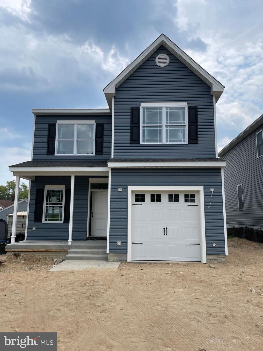 Still time to choose custom touches in this beautiful new construction home. Over 3,200 sq ft of finished living space to enjoy! Act quickly to choose paint, granite, flooring etc. This stunning home located near the end of a dead end street adjacent to Sunset Park and walking distance to Sunset Elementary School will be move in ready in July. Bring your boat and water toys to enjoy the waterfront community pier, beach and boat ramp. Nothing in this beautiful new 4 bedroom, 2.5 bath house is builders grade, you must come see to understand; just some of the upgrades you will find are 2 zone heating and air-conditioning , crown moulding, tile in bathrooms, sound proof owners suite, insulated and finished garage, 9 foot ceilings on main floor and in finished basement. In the gourmet kitchen you will enjoy a large granite island, soft close cabinets, under cabinet lighting, tile backsplash, and stainless steel appliances. Finished basement has rough in for additional bath. Put this one on your list and see it soon to customize for yourself!