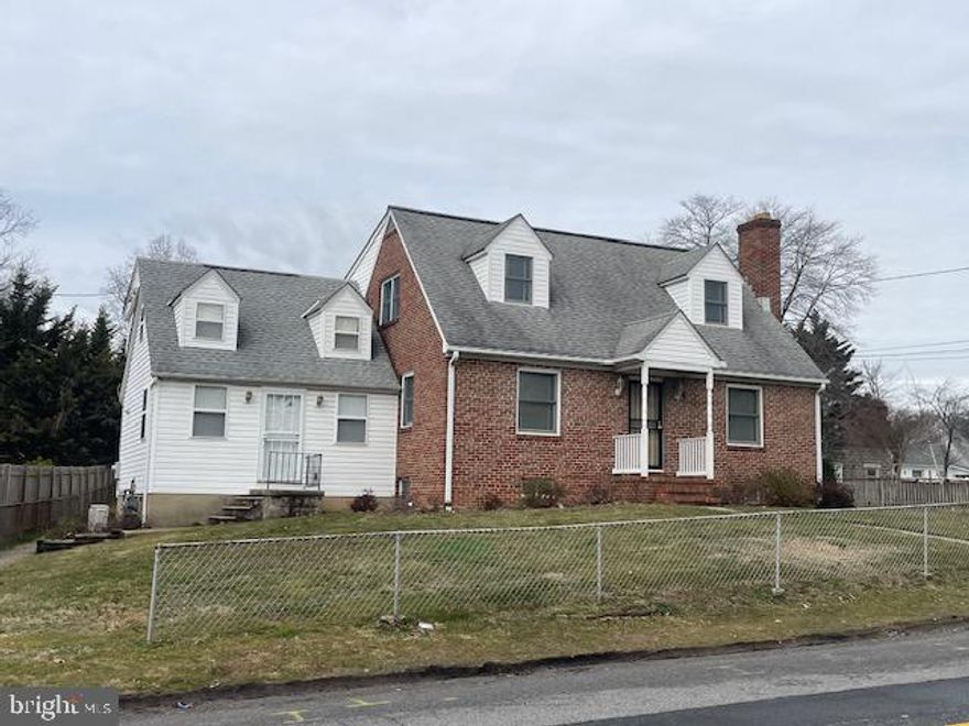 What a terrific property! Main house is adorable with large rooms and convenient first floor bedrooms and bath.  Hardwood floors in great condition throughout most of the home.  Travel up hardwood stairs to two additional expansive bedrooms with Jack and Jill bath.  Loads of closet storage.  Kitchen has so much space for additional cabinetry and seating. First floor laundry with utility sink.  The basement just keeps going and going.  So much space to live and play. Convenient additional utility sink and full bath.  This property also includes the attached, but totally separate, dwelling that could serve as a potential rental or in-law suite.  Features a living/dining combo, lovely kitchen, full bath, and upstairs bedroom. It has its own basement area with W/D, utility sink and loads of storage. Sit on the deck and enjoy the weather.  Huge, detached garage has tons of storage including an attic.  Make your appointment - this one won't last long!!  Photos will be taken 3/21/26. Property is being sold AS-IS; Seller will not make any repairs!!