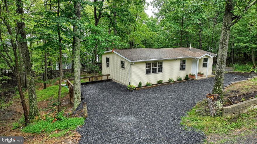 Charming Renovated Ranch in the Wooded Community of Wild Acres 🌲🏡

Welcome to this beautifully renovated 2-bedroom, 1-bath ranch-style home nestled in the serene and private subdivision of Wild Acres. Tucked among the trees, this 960 sq ft home offers the perfect blend of modern updates and cozy charm. Perk is for a one bedroom but home technically has two bedrooms

Inside, you'll find a fully updated interior featuring fresh finishes throughout, with a new well, septic system, and AC unit providing peace of mind for years to come. The bright and open living space flows seamlessly into a well-appointed kitchen, making it ideal for relaxing or entertaining.

Enjoy your morning coffee or unwind in the evening on the cute back deck just off the bedroom—your own little retreat in nature. Whether you’re looking for a full-time residence, a weekend getaway, or a short-term rental opportunity, this home offers easy living in a peaceful, wooded setting.