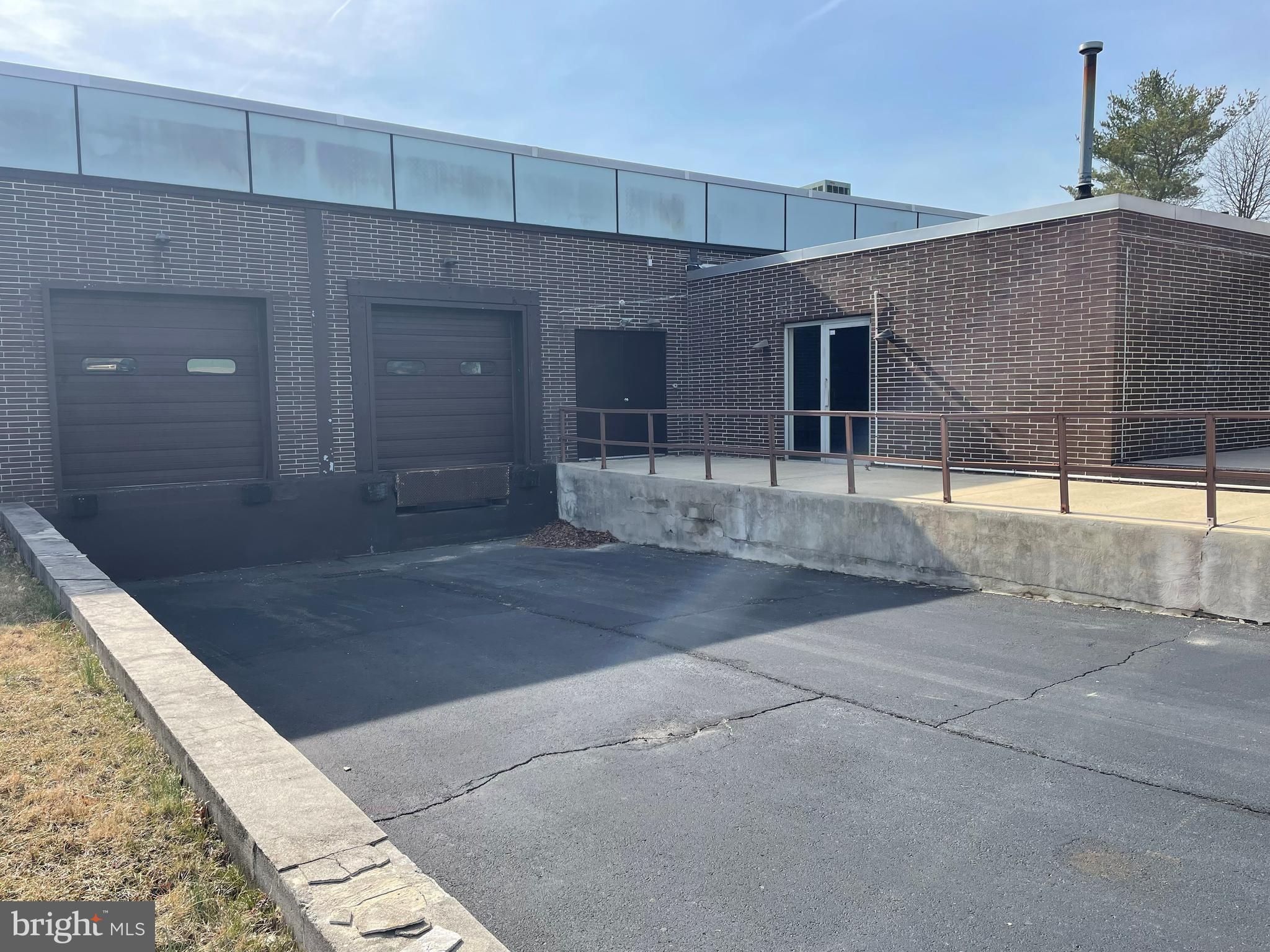 16,080 SF with 2,000 +/- SF of office - the remainder in shop/ warehousing space. The offices are centrally aired and have 5 private offices, one large reception office with kitchenette area and two restrooms. The offices have been recently carpeted and painted. The shop/ warehouse space features 14 foot ceilings, 2 restrooms, sprinklers, 3 phase 400 amp electrical service, gas radiant heat, two docks (one with leveler) and one drive in door (12 foot high). $8 per SF per year plus "nets" ("Nets" are $2.75 per SF per year (or $3,685 per month). 5 year lease required with 4% annual increase to base monthly rent and "nets". Ceiling fan is NOT operable and cannot be used.