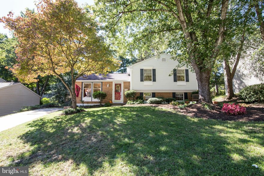 Open and spacious 4 level home. Cathedral ceiling on main level with updated kit. Fresh paint and new carpet.  Updated baths w/ 3 br up and 4th br and full bath on lower level with Family room and fireplace. 4th level makes great work/storage area or room to expand. Large deck and fenced yard. Lots of landscaping. Located on quiet cul-de-sac. Great community with beaches, pool, golf and playground