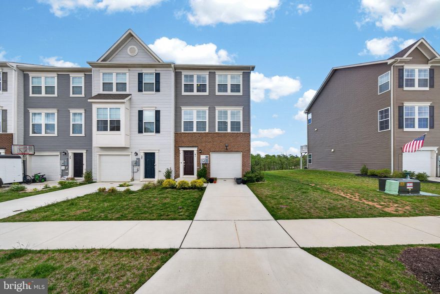 Welcome to Norborne Glebe, one of Charles Town’s most sought-after communities, where this beautifully maintained end-unit townhome offers enhanced privacy, open views, and thoughtful upgrades that truly set it apart from standard new construction. Built in 2023, this 3-level home features 3 bedrooms, 2 full baths, and 2 half baths with a functional open layout designed for modern living. Positioned as a desirable corner unit with no homes directly in front, this property captures peaceful sunrise and sunset views while offering a more open and spacious feel rarely found in townhome communities.

Unlike nearby builder-grade homes, this property is truly move-in ready with valuable upgrades already completed for the next owner, including ceiling fans throughout, window blinds installed, a water softener system, and a whole-home water filtration system, saving buyers thousands in additional expenses after closing. Buyers will also appreciate the advantage of moving into an already established section of the community without having to deal with ongoing nearby construction, constant contractor traffic, noise, dust, or unfinished surroundings often associated with purchasing directly from new construction communities. The entry level offers a versatile recreation space ideal for a home office, gym, or secondary living area with access to the backyard and peaceful surroundings.

The main level features an open-concept design with a spacious family room flowing seamlessly into the kitchen and dining area. Adding an upscale touch to the living space is a high-quality modern electric fireplace feature wall, creating a warm and luxurious focal point where the TV area is positioned. The kitchen includes granite countertops, stainless steel appliances, ample cabinet space, and a large center island perfect for entertaining or everyday living. Step outside onto the rear deck and enjoy added privacy along with open views that make this home stand out from the rest.

Upstairs, the primary suite offers a spacious retreat complete with a dual vanity ensuite bath, tiled shower, and generous walk-in closet. Two additional bedrooms, a full hall bath, and an upper-level laundry area complete the top floor.

A rare opportunity to own a newer end-unit home in Norborne Glebe with premium views, added privacy, luxury touches, and meaningful upgrades already completed for you.