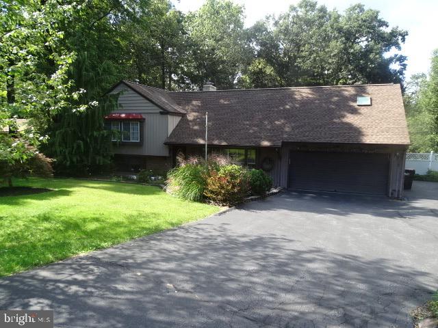 Spacious 5 bedroom, 3 full bath home with a private back yard located in a nice wooded development. This home offers 4 levels of living space. Main level has kitchen/dining combo, living room, laundry room, sun room with large deck outback. First upper level has 3 bedrooms and 1 full bath. Second upper level has 2 bedrooms and 1 full bath. Basement offers a full bath, finished room with fireplace. Updates throughout.
