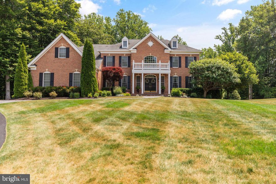 Welcome home to Toll Brothers Hampton Model - this magestic home offers an open floor plan with 4/5 bedrooms and 6 bathrooms, finished lower level, 3 car garage, heated salt water pool and spa and so much more.  Come on in and take a look-first the elegant foyer with the grand double staircase,  2 guest coat  closets, hardwood floors flowing into the LR, DR, and family room, wainscoting  in the LR, DR and foyer, all updated lighting fixtures,  box beamed ceiling in the family room w/gas fireplace, huge gourmet kitchen with a 12 foot island, granite counters, stainless steel  appliances to include a side by side refrigerator,  microwave and wall oven combination, gas range with full oven and grill, double  drawer refrigerator, wine cooler, double stainless sink and ceramic tile backsplash.  The kitchen has a huge dining area  with French doors  leading to a 2 tiered deck and the backyard.  The kitchen and dining space are open to a sunfilled sunroom, both rooms having ceramic tile flooring -great for those wet feet as you come out of the pool!!  Right off of the kitchen is a large mudroom with a double door closet so convenient for family coats and that leads into  a wonderful laundry room with extra cabinets and a laundry sink-a door leads out to the driveway and side yard.  A 3 car garage sits right next to the mudroom.  There is a first floor study/bedroom with neutral carpet, ceiling fan, and plantation shutters-a full bath is right next to this room.  The dual staircase or a back staircase carry you up to the upper level where you will find 5/6 bedroooms, 4 bathrooms and a double door linen closet.  The Primary bedroom has a sitting area  with columns separating it from the sleeping area.  There are hardwood floors and elegant crown molding with a modified  cathedral ceiling with ceiling fan.  The Primary bath has a soaking tub, oversized shower with seat and double shower heads, 2 water closets, 2 huge  vanities with loads of drawers and storage space and plantation shutters.  There is a sizable walk in closet in the sleeping area with a greatly oversized walk-in closet on the other size of the bathroom - the built-ins eliminate the necessity for dressers in the sleeping area.  Bedroom 1 could be a 2nd Primary suite as Bedroom 1 & 2 could be combined as there is a  pocket door between the 2 rooms- each room has  neutral carpet, neutral walls-in Bedroom 1, there is a ceiling fan and 2 walk-in closets.    The bathroom for these 2 rooms has a double vanity,  shower and  plantation shutters. Bedroom 3 has neutral carpet and walls, a double door closet, ceiling fan and a private bath with a tub.   Bedroom 4 has neutral carpet and walls, a walk-in closet and a ceiling fan.   This bedroom  shares a bathroom with a hallway entrance.   The LL has the potential of an in-law suite and further expansion if needed.  The suite has a sitting room with neutral carpet, a ceiling fan, recessed lighting, a walk-in closet, a full bath and the bedroom has a ceiling fan.  The LL family room has new Luxury vinyl flooring, surround sound, recessed lighting and a  French Door leading out to the backyard.  There are 3 doors for the enormous storage area-opportunity for further expansion if  desired. The outside has a 2 tiered  composite deck w/retractable awning,  stone and Traverine tiles for patio area, heated salt water pool and spa , stone water feature, Bluetooth for the pool,  gas fire pit,  gazebo, and a commercial grade black aluminum fence surrounding the back yard.  The pool has a self-cleaning device that is included.  The upper level heat pump was recently replaced with an upgraded system.  The lighting fixtures have all been upgraded and convey as do all of the window treatments.   There is extensive hardscaping and the front walkway was replaced with a custom one w?sidewalk lighting.  The inside of the house has also just been freshly painted.  A wetlands/conservation easement on the side and back will keep this a private oasis.