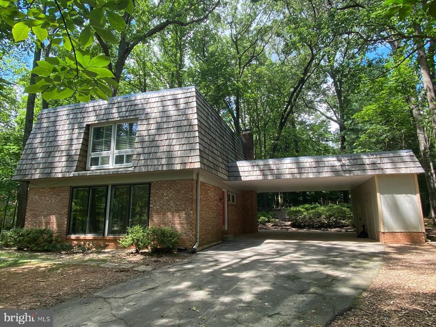 Coming Soon! This beautiful home sits on .34 acre tucked away in a picturesque, serene wooded lot.  Hardwoods throughout, with the main floor just refinished.  The kitchen, the heart of the home gives you an incredible view of nature at your back door, with a large breakfast area, wood burning fireplace, and patio doors that take you right to your generous backyard and patio.  New kitchen floor, freshly resurfaced cabinets, new dishwasher, range only 2 years old.  Upstairs are 3 bedrooms and 2 full bathrooms with newer picture windows again offering non-stop nature views. Updated master bath with oversized dressing area. Shared bath with new banity. Finished basement with gas fireplace, half bathroom,  plus a huge storage room or workout room. Just steps away from 100+ miles of trails. Within walking distance you will discover the nature center, community pool, tennis courts, and more. Easy commute with bus stop only one block away. Close to Reston Wiehle Metro Station (2.5 miles), connected by bus, car or bike ride. You do not want to miss this home!