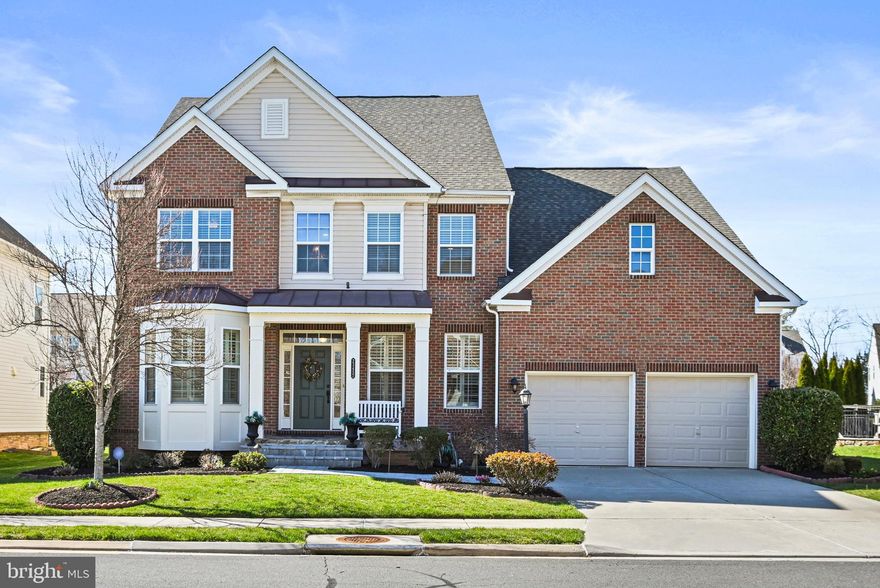 Welcome to your new home at 23457 Somerset Crossing Pl, an exquisite 5-bedroom, 4.5-bathroom residence nestled in the heart of the Brambleton community. Boasting 5342 SF of comfortable living space, this home offers superb amenities and upgrades sure to delight.

Situated on a desirable lot, the property features manicured landscaping, sprinklers, spot lighting, stone steps, and a charming porch. Its brick façade with siding on three sides adds to its appeal.
Step inside to be greeted by a two-level Foyer adorned with beautiful hardwood flooring that extends throughout the main floor. The formal dining and study areas lead to a majestic two-level Family room illuminated by natural light and anchored by a gas fireplace.

The gourmet kitchen with stainless steel appliances, complete with a large island, butler's pantry, and breakfast area, is perfect for entertaining guests. A cozy sunroom flows seamlessly into sliding doors opening onto a delightful outdoor patio area, ideal for grilling and gatherings.

This home boasts 7 ceiling fans, recessed lighting, and newly painted areas complemented by designer window shutters. A standout feature is the main floor secluded owner’s suite, featuring a tray ceiling, luxurious master bath with soaking tub and walk-in shower, as well as a separate commode area with a bidet toilet. Custom closets by design offer ample space for outfits and personal items, while a newly added screened porch accessible from the master suite or patio provides a serene retreat for enjoying the outdoors.

Ascending hardwood stairs with a landing lead to a spacious loft area on the upper level, along with three well-appointed bedrooms and two full baths, including a jack and jill bathroom. Wall-to-wall carpeting ensures comfort throughout this level.

The lower level is a true standout, offering nearly 1900 SF of finished basement area featuring a full gourmet kitchen with stainless steel appliances, bar area with beautiful cabinets, and a fully furnished home theater with electric recliners for movie or sports nights. A spacious recreation area with hardwood flooring doubles as a dance studio, while a full bath and bedroom make the basement perfect for accommodating guests. A walk-up basement provides convenient access to the patio and backyard.
Meticulously maintained with no pets, this home features a new 2023 Lennox HVAC system in the basement. A large storage area offers plenty of space for stashing belongings.

Make this your perfect next home and cherish all it has to offer!