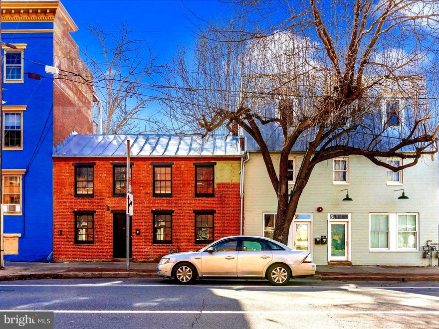 Introducing a unique Investment opportunity located on South Street in downtown Frederick, MD!
This offering includes two distinct buildings. The first, 4 W South, is a charming two level residence featuring  two bedrooms, one bathroom, an efficient kitchen, hardwood flooring and a distinctive outdoor space .  The second building exudes an industrial aesthetic and houses a two-unit apartment complex.  The  main floor unit (6A) is a spacious one-bed, one-bath layout with cement floors, large kitchen with skylight. The upper floors form a cohesive unit, with the second floor offering a one-bed, one-bath living space and kitchen, while the third floor loft, accessible by a spiral staircase, opens into a generously sized room with a wall of windows flooding the space with natural light and leading to an exceedingly impressive rooftop terrace/balcony.   
This property promises a blend of character, versatility, and urban living,  making it an ideal investment in the heart of Frederick! Just steps away from Market St., with restaurants, breweries, and activities galore!