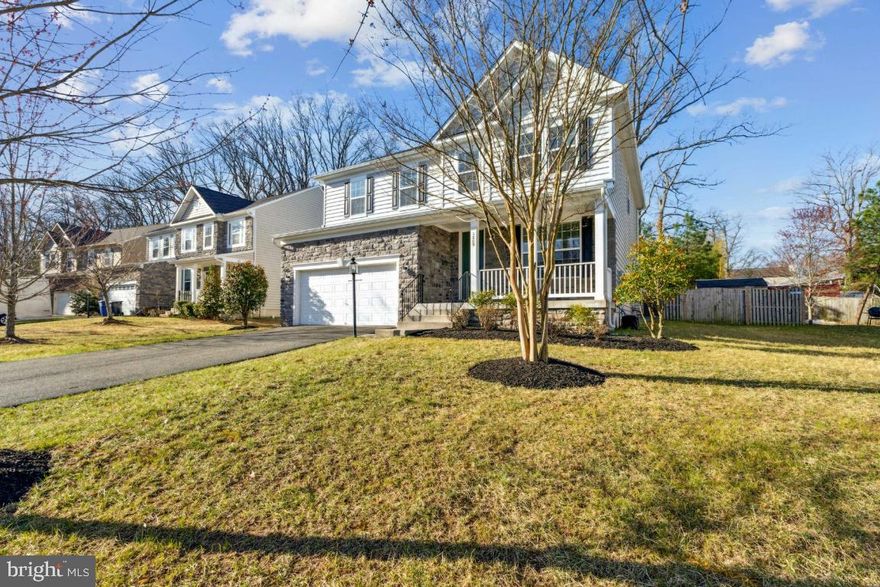 Welcome home to this beautiful, like-new residence spanning over 4,000 square feet with full  in-law or au pair suite. This four-bedroom, four-bathroom house features a spacious gourmet kitchen equipped with stainless steel appliances, granite countertops, and custom cabinetry. The extra-large living room, complete with a fireplace, flows into a bright and inviting sunroom, a dining room, and an oversized study, all located on the main level. The hardwood floors throughout have just been refinished, adding to the home's charm.  The open-concept design of the kitchen, living room, and sunroom provides direct access to a lovely, fenced yard that is perfect for entertaining. Upstairs, you will find a spacious open upper-level family or study area, along with four bedrooms. The oversized primary bedroom includes an ensuite bathroom and a walk-in closet. Additionally, there are three more generous-sized bedrooms and a large three-piece bathroom, as well as a laundry room on this level.  The lower level features walk-up exterior access and includes an enormous recreation room, an exercise room, and a perfect in-law or au pair suite with a full bathroom. There is also an unfinished utility room offering ample storage and shelving. The property boasts an oversized two-car garage, complete with racks and plenty of space for SUVs.  Conveniently located near commuter lots and I-95/HOT lane access, this home offers easy travel to the Pentagon, Arlington, and Washington, DC. Enjoy quick access to Wegmans and Potomac Mills, with a short five-minute drive to Quantico Marine Base.