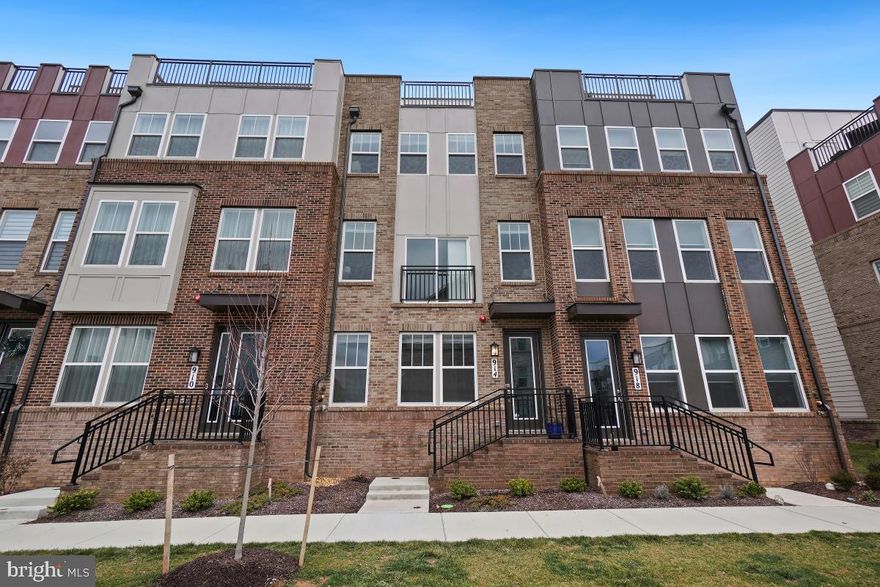 Welcome to the epitome of luxury living in the newly built Crown Farm community! This stunning townhome offers over 2,600 square feet of meticulously designed living space spread across 4 finished levels. With 4 bedrooms, 4.5 bathrooms, and an attached 2-car garage (with electric car charge), this home effortlessly combines style and functionality.

Enter on the lower level with convenient garage access, a generously sized family room/flex space, and a full bath. Moving up to the main level, an open concept layout seamlessly integrates the living, dining, and eat-in kitchen areas. The gourmet kitchen boasts quartz countertops, an island with breakfast bar seating, and custom cabinetry. Top-of-the-line stainless steel appliances, including a wall oven and gas range, elevate the space. Gorgeous wood flooring extends throughout, creating a warm and inviting ambiance.

Off the kitchen eat-in space is the spacious back deck that is perfect for entertaining. The living room is bright with large windows and features a sliding door to invite the outdoors in. The upper bedroom levels showcase 4 bedrooms and 3 bathrooms. The primary suite is a haven of sophistication with a tray ceiling, walk-in closet, and a luxurious ensuite bath. The ensuite includes a double sink vanity and a spa-like walk-in shower with beautiful tilework detail. The remaining bedrooms share a full bath, and a convenient bedroom-level laundry room adds practicality.

The top level is a retreat in itself, featuring a spacious rec room with a wet bar and access to the outdoor rooftop deck. An additional bedroom and bath on this level offer flexibility and convenience. The community amenities abound, including a swimming pool, bike trail, community center, jog/walk path, picnic area, tennis courts, tot lots/playground, and more. Home can come furnished, or not!

Convenience is key, with the property being walkable to Downtown Crown and Rio Centers, offering a plethora of shops, restaurants, and entertainment venues. Commuting is a breeze with easy access to I-270, ICC, and public transit. Experience the pinnacle of modern living with this exceptional townhome in the heart of Crown Farm!