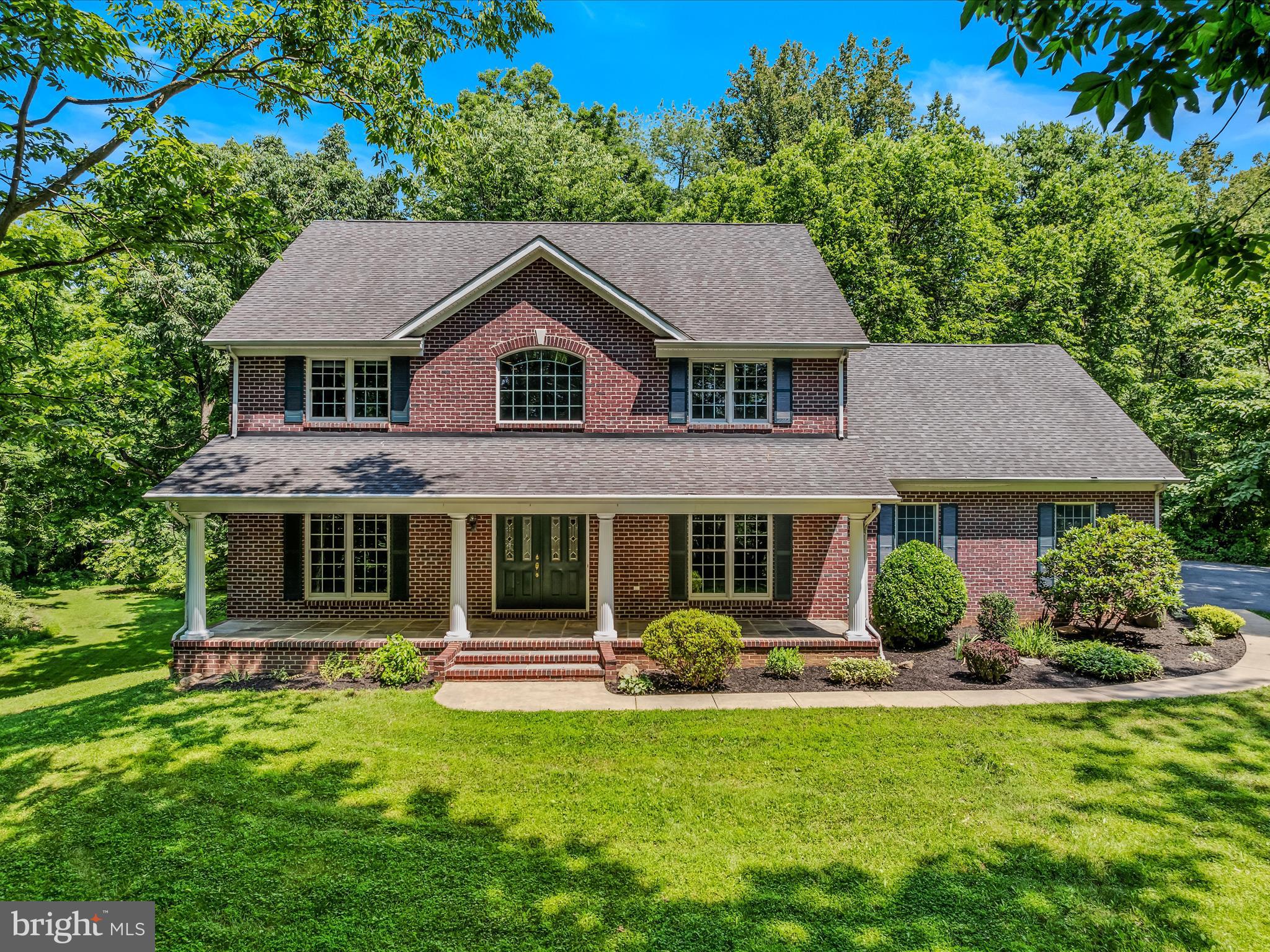 This all-brick colonial is a true classic. It sits of over 3 and 1/2 acres of Jefferson County's finest land. Your large lot is surrounded with trees for tons of privacy. Once you clear the trees on your long driveway you will be taken away by this home's curb appeal. A beautiful concrete path leads you from the driveway, passed the manicured landscaping, to the lovely front porch. Can't you just see yourself enjoying a cup of coffee or a glass of wine and taking in the beautiful views? Inside the front door you are greeted by a grand two-story foyer with hardwood floors and handsome transoms. To your left you have the formal living room with carpet, a ceiling fan, and tons of natural light. This space could also serve as a great office. Glass paned lead out to the kitchen. To the right of the foyer, you have the formal dining room. Here you'll find hardwood floors, built in bookshelves, and a gar fireplace. A butler's door to the pantry and kitchen make hosting dinner parties a breeze. The pantry is huge with wood shelving and provides plenty of space for your storage needs. Beyond this you have the open kitchen. It features a large two-tier island for extra storage and breakfast bar seating. This space is topped off by stainless appliances, recessed lighting, and crown molding. There is a large breakfast nook with hardwood floors and access to the rear deck. A decorative light fixture defines the space. Down the hall you have a large laundry room with easy-care vinyl floors and storage shelves. The main level full bath features vinyl floors, pedestal sink, and walk-in shower, so convenient for guests. The kitchen and breakfast nook are open to your spacious family room. This space features carpet, crown molding, and a gas fireplace. This set up is great for entertaining all year round. The large windows bathe you in natural light. Up the stairs you have a hall with hardwood floors. Bedroom 2 features carpet and is a junior suite with a private ensuite full bath. The ensuite features an extended single bowl vanity for ample storage and an acrylic tub/shower. Bedroom 3 features carpet ceiling fan and ample closet storage. Bedroom 4 features hardwood floors and chair railing molding. Bedrooms 3 & 4 share a large Jack and Jill bath. The bath features separate, extended single bowl vanities, and a water closet with toilet and tub/shower. The primary suite is carpeted and features vaulted ceilings and ceiling fan. Your suite includes a private ensuite bathroom with double bowl vanity, large soaking tub a walk-in shower. The suite is topped off by a huge walk-in closet with wood shelving. You will want for nothing in this private oasis. The 3 car garage keeps you, your car, and your yard tools/toys of out the weather. What a blessing in this heat! Outside you have a large rear deck that is perfect for hosting your summer BBQ's. A ramp provides access to the driveway and your rear yard. Rear yard has been cleared and is nice and level with mature trees all around. There is no shortage of privacy no matter where you are on your lot.