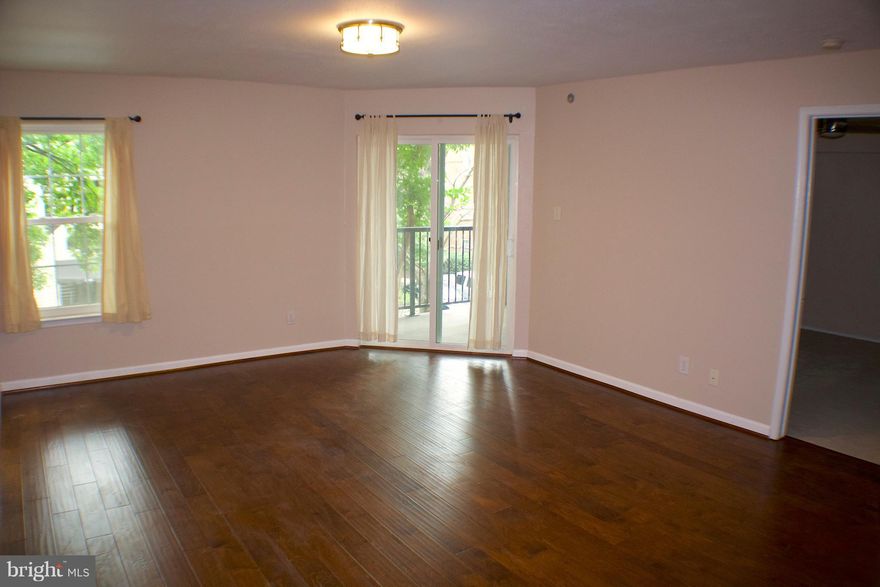 Beautiful condo with all the upgrades to include granite counter tops, maple cabinets, stainless steel appliances, new wood laminate floors, and more.  Located in a gated community with all the amenities; pool, fitness center, underground parking, guest parking and community center. Free shuttle takes you to metro.