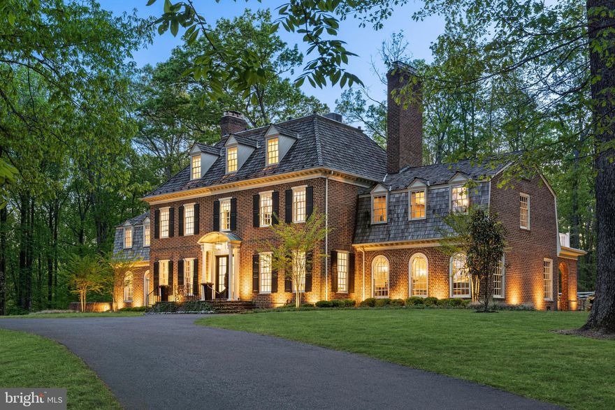 13300 Manor Stone Drive is a hidden gem along River Road, neighboring the Bretton Woods Club. Originally built by master builder Patrick Cullinane, the home has been recently transformed with no expense spared. The elegant black wide-plank hardwood floors and intricate millwork complement the red brick facade and traditional center hall floor plan.

The home features a formal dining room, living room, family room, double-height library, and a showstopping kitchen with Brazilian quartzite countertops. The primary suite has dual walk-in closets and a luxurious bath with heated black and white marble floors. The upper levels have four secondary bedrooms with ensuite baths and laundry facilities.

The lower level is an entertainment hub with a large recreation space, fitness center, full bath, and professional home cinema with a starlight ceiling. The home boasts premium touches such as Restoration Hardware fixtures, Emtek hardware, and custom interior doors. Surrounded by natural beauty, it offers a peaceful escape from urban living.