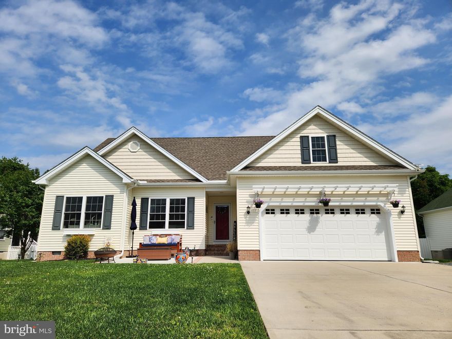 Meticulously kept home on a low traffic street walking distance to everything Berlin.  Open concept layout , hardwood floors, custom gas fireplace. Cathedral ceiling in living / dining area make the space feel  larger.  Fixed stairs to attic with lots of storage space or finish off for more living space .  Screened back patio, privacy fenced yard with 3 locking gates, pavered fire pit area and new exterior storage shed . Garage is drywalled and painted with nice work bench area and dog wash station.