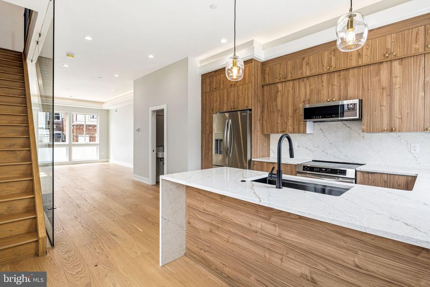 Welcome to Elkhart Residences, a stunning new construction townhome community redefining modern living in one of Philadelphia’s fastest-growing neighborhoods. These sleek, design-forward homes offer 1,800–2,000 square feet of stylish living across three spacious levels—each complete with the rare luxury of private parking.

Step inside to find wide-plank hardwood flooring, statement tray ceilings with ambient lighting, and sun-drenched open layouts highlighted by dramatic glass partitions. Every detail has been thoughtfully curated, from heated floors in all bathrooms to the spa-inspired primary suite and elegant soaking tub on the second floor.

The homes also feature an expansive unfinished basement with over 600 square feet of opportunity—perfect for creating the ultimate bonus space—with select residences offering finished options. Top it all off with your private third-floor balcony, ideal for entertaining or unwinding above the city.

With all appliances included and a prime location just minutes from parks, schools, and the best of Port Richmond, Elkhart Residences delivers the perfect blend of luxury, convenience, and new construction appeal.