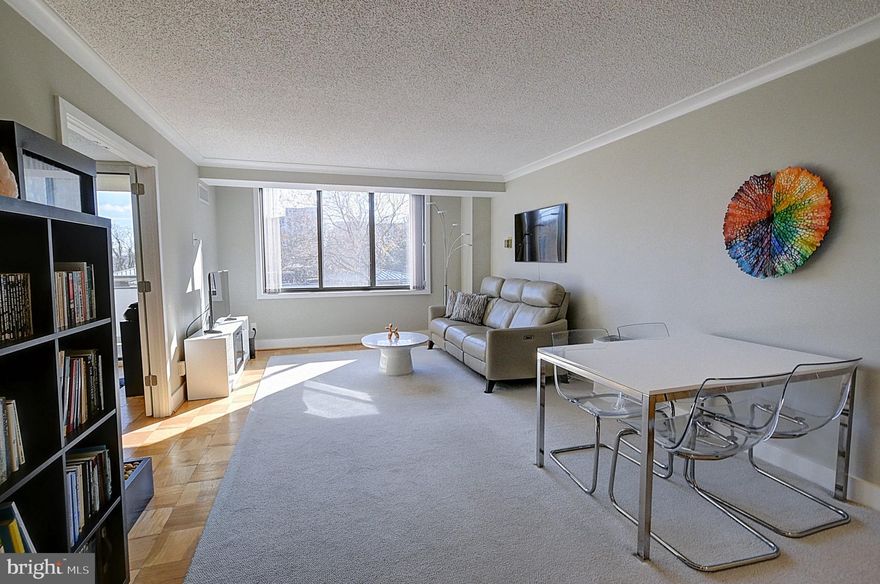 Welcome to this exceptional two-bedroom residence at The Promenade, featuring over $95,000 in thoughtful upgrades. In 2017, both the kitchen and bathroom were completely gutted to the studs and rebuilt, creating a home that seamlessly blends modern luxury with timeless appeal.
<br><br>
Enter through an upgraded front door with new lock, deadbolt, doorknocker, and peephole into a welcoming entryway with a lowered architectural ceiling and five adjustable recessed overhead lights.
<br><br>
The stunning kitchen features tile flooring and showcases three walls of spacious wood cabinetry with self-closing doors, including a large pantry, complemented by three walls of marble countertops and a modern backsplash. All major appliances were purchased new in 2017, including a GE refrigerator with exterior water/ice dispenser, GE dishwasher, GE stove and microwave, garbage disposal, and an LG washer/dryer approved by Promenade management. Under-cabinet adjustable brightness lighting and modern overhead fixtures illuminate the space beautifully. A nearby bar area with three glass shelves, granite countertop, mirrored wall, large wood cabinet storage, and adjustable recessed lighting creates the perfect entertaining space.
<br><br>
The renovated bathroom features a high-level granite vanity with 8 self-closing drawers and generous central compartment, a large medicine cabinet with four adjustable volume lights above, a separate heat-lamp light, adjustable lighting over the shower, upgraded electrical sockets, upgraded toilet, and a modern shower with built-in seat.
<br><br>
Elegant six-inch baseboards and crown molding grace every room, while the original parquet floors have been machine-sanded and finished with four coats of premium water-based polyurethane. Television cables are hidden within the molding and walls for a clean aesthetic.
<br><br>
The second bedroom/study features two frosted glass French doors that can open to expand the living space or close for privacy. Inside you'll find modern overhead lighting, ceiling-to-floor modern blinds by Blinds-to-go, a completely updated electrical panel (GE120 fuse box with room for additional switches), and a balcony just one floor above the gardens with a sealed floor and painted inner wall.
<br><br>
The spacious living room offers beautiful, unobstructed views of the outdoor pool and gardens through windows framed by 2.25-inch casement for added eye appeal. A convenient utility/coat closet near the kitchen provides double-hung rods and moveable shelving. The hallway features a large closet with center shelves between two areas of double-hung rods. The master bedroom includes a cable port for TV, windows framed by 2.25-inch casement, and a large walk-in closet with floor-to-ceiling shelves in the center and rods on both sides with two levels of shelves above for additional storage. An entry-way closet offers two double-hung clothing areas, a single-hang clothing rod, and shelving. All of the unit’s closets were professionally designed to maximize storage space.
<br><br>
The Promenade offers resort-style amenities including indoor and outdoor pools, 7 tennis courts, pickleball, a racquet club house, and a state-of-the-art exercise & fitness center complete with an indoor pool, sauna, lockers, and hot tub. The building offers outstanding conveniences with 24-hour security gate house, front desk service, remodeled arcade with various stores, and Chef Tony's restaurant featuring poolside dining. Additional on-site services include a convenience store, dry cleaners, package room, beauty salon, party & game room, and travel agency.
<br><br>
Schedule your viewing of this meticulously upgraded home today.