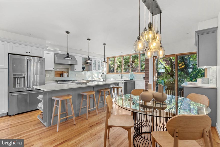 Located on a quiet, tree-lined street in the sought-after Greenfield Catchment School District, home to the nationally recognized Blue Ribbon Albert M. Greenfield School, this stunning townhome offers the perfect blend of comfort, style, and city convenience. Offering 3 spacious bedrooms, 2.5 bathrooms, and garage parking, this thoughtfully designed home boasts abundant natural light and stylish finishes throughout. Upon entry, you're welcomed by a large foyer with 9-foot ceilings, direct access to the attached garage; a few steps down leads to a versatile family/playroom and a convenient powder room. Upstairs, the dramatic 13-foot ceilings and expansive windows in the living room provide breathtaking skyline views. A wood-burning Franklin stove adds warmth and charm, while sliding glass doors open to a large private patio and garden. Overlooking the living area is the heart of the home: an impressive chef’s kitchen and dining space. The gourmet kitchen features high-end appliances, a farmhouse sink, quartz island with a second sink, gas range, coffee/wine bar, and a beverage refrigerator. A balcony overlooks the serene, tree-lined street. Just above, a cozy loft space serves as a perfect reading nook or home office, again offering those spectacular skyline views. The primary suite includes a skylight, custom cabinetry, radiant heated floors, and a luxurious rain shower. Additional levels feature two more spacious bedrooms, a full bathroom, and a dedicated laundry room. Throughout the home, you’ll find custom woodwork and hardwood flooring, adding warmth and character to every space. Just steps from Philadelphia’s best restaurants, shops, parks, and museums, this home is a rare find in an unbeatable location. Taxes and square footage is the responsibility of the buyer to have verified independently.