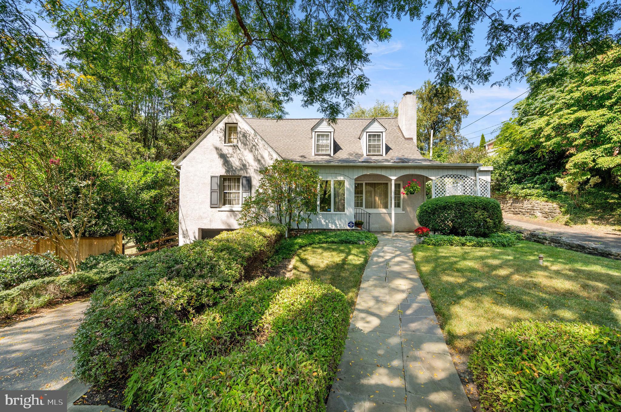 Live in the heart of one of Chestnut Hill's most charming and centrally located neighborhoods. This classic Rex Avenue home, featuring 4 bedrooms and 4 bathrooms, offers a formal living room, formal dining room, large kitchen, private study, and a spacious bonus room (ideal as a playroom, additional office, family room, or fifth bedroom) with a full bathroom on the first level.
The second level includes a private primary suite with a full bathroom and large walk-in closet, with three generously sized secondary bedrooms and a full hall bathroom. A fully finished lower level provides expansive space for a playroom, family room, office, or exercise room, plus a full bathroom and access to the side yard.
This large and private property features a front yard set back from Rex Avenue and a serene backyard with a flagstone patio spanning the length of the house, accessible through three sets of sliders from the first floor. The front yard and terraced rear grounds are filled with mature plantings, enhanced by the charm of a quintessential Chestnut Hill Wissahickon schist wall enclosing the entire rear yard. An attached garage and long driveway provide ample off-street parking.
Situated at the “Top of the Hill,” this home is just a short walk to the Chestnut Hill West Train Station and the iconic Germantown Avenue, offering restaurants, boutique shops, and a beautiful branch of the Philadelphia Library. Its proximity to the renowned Wissahickon Valley provides the perfect setting for hiking and outdoor activities.